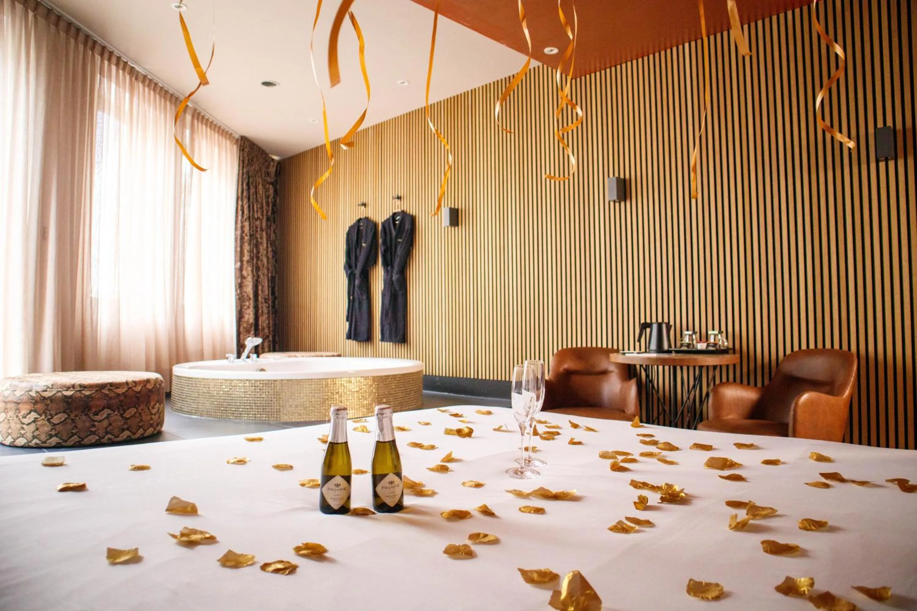 Seating area, Bed in Manzo's Suites