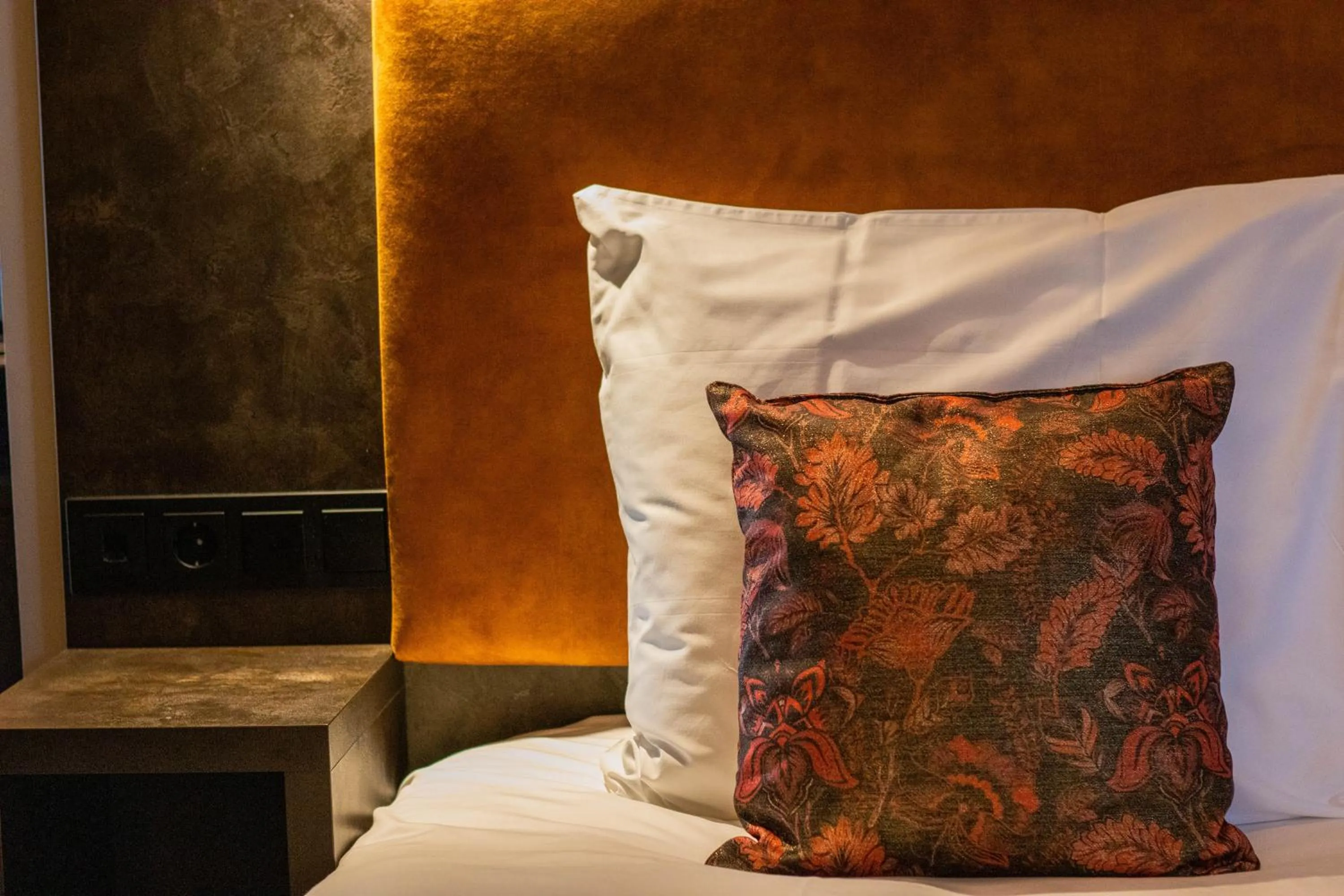 Bed in Manzo's Suites