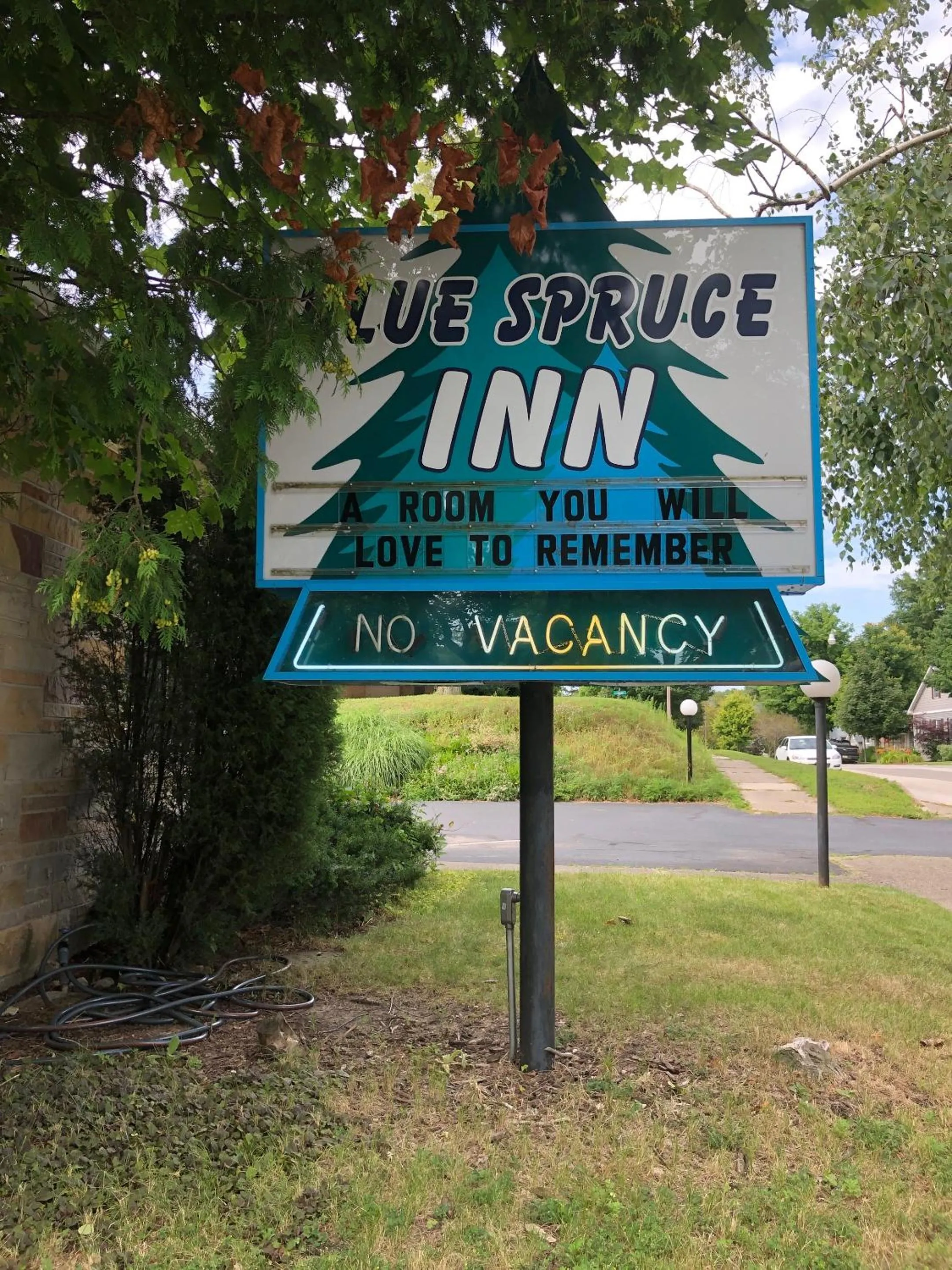 Property building in Ludington Blue Spruce Inn