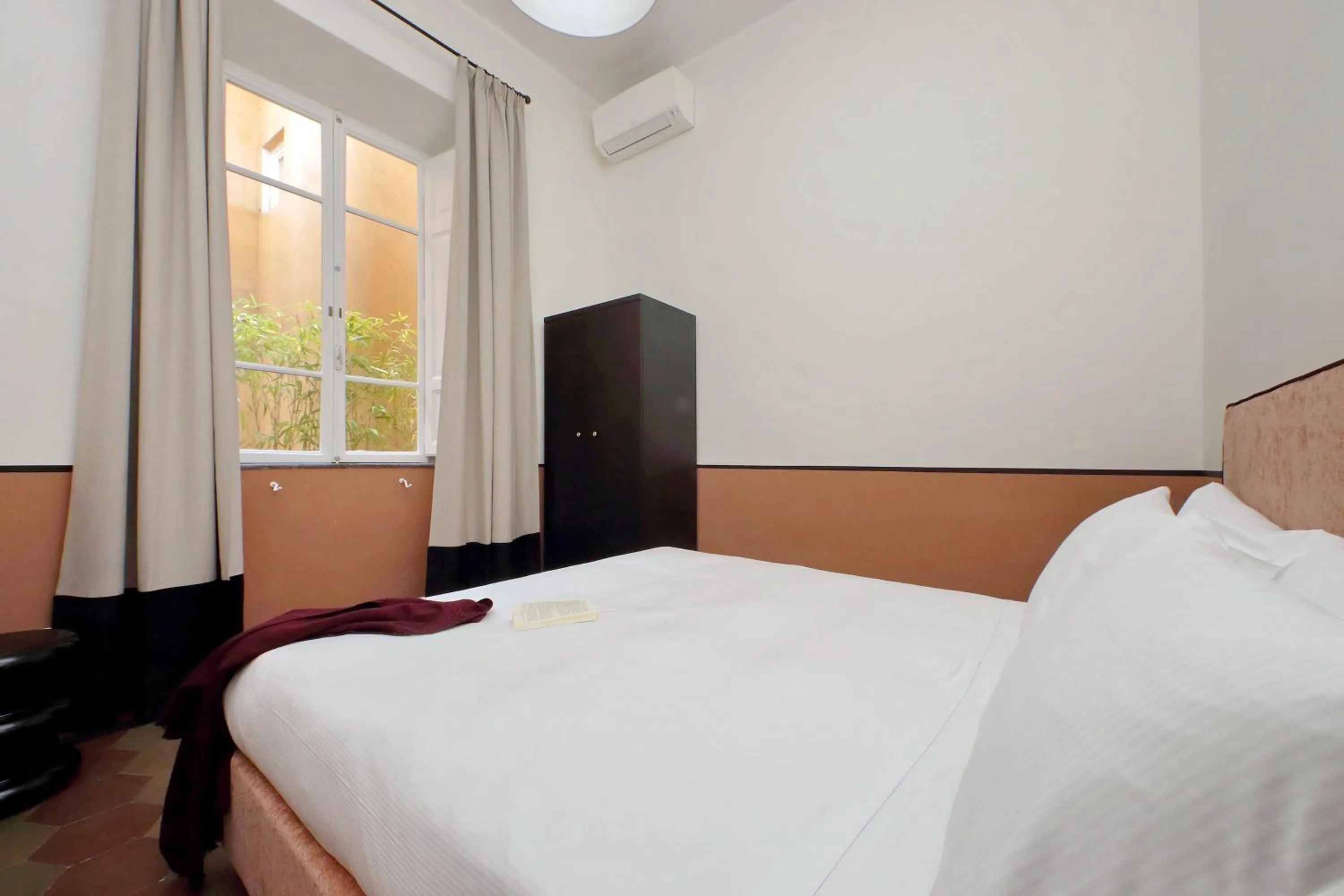 Bed in Monti Apartments - My Extra Home