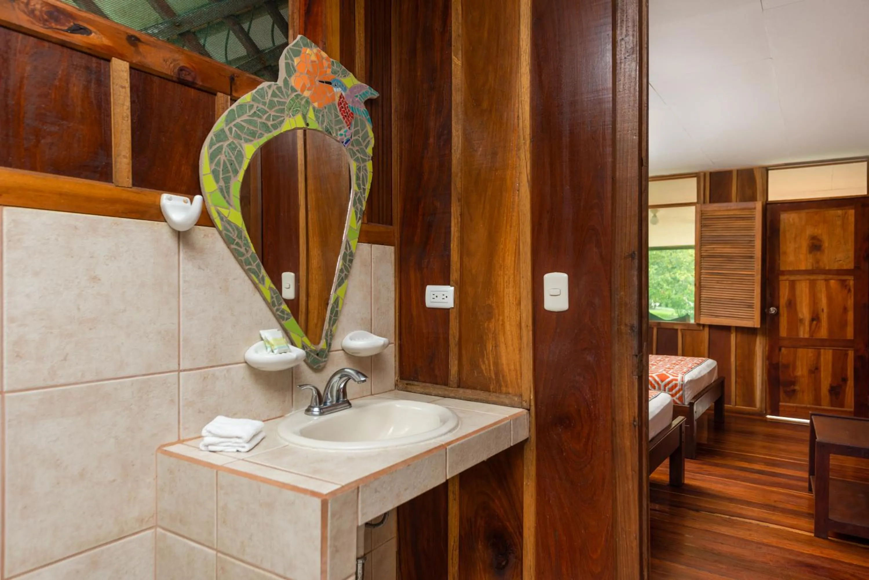 Bathroom, Bed in Laguna Lodge Full Board