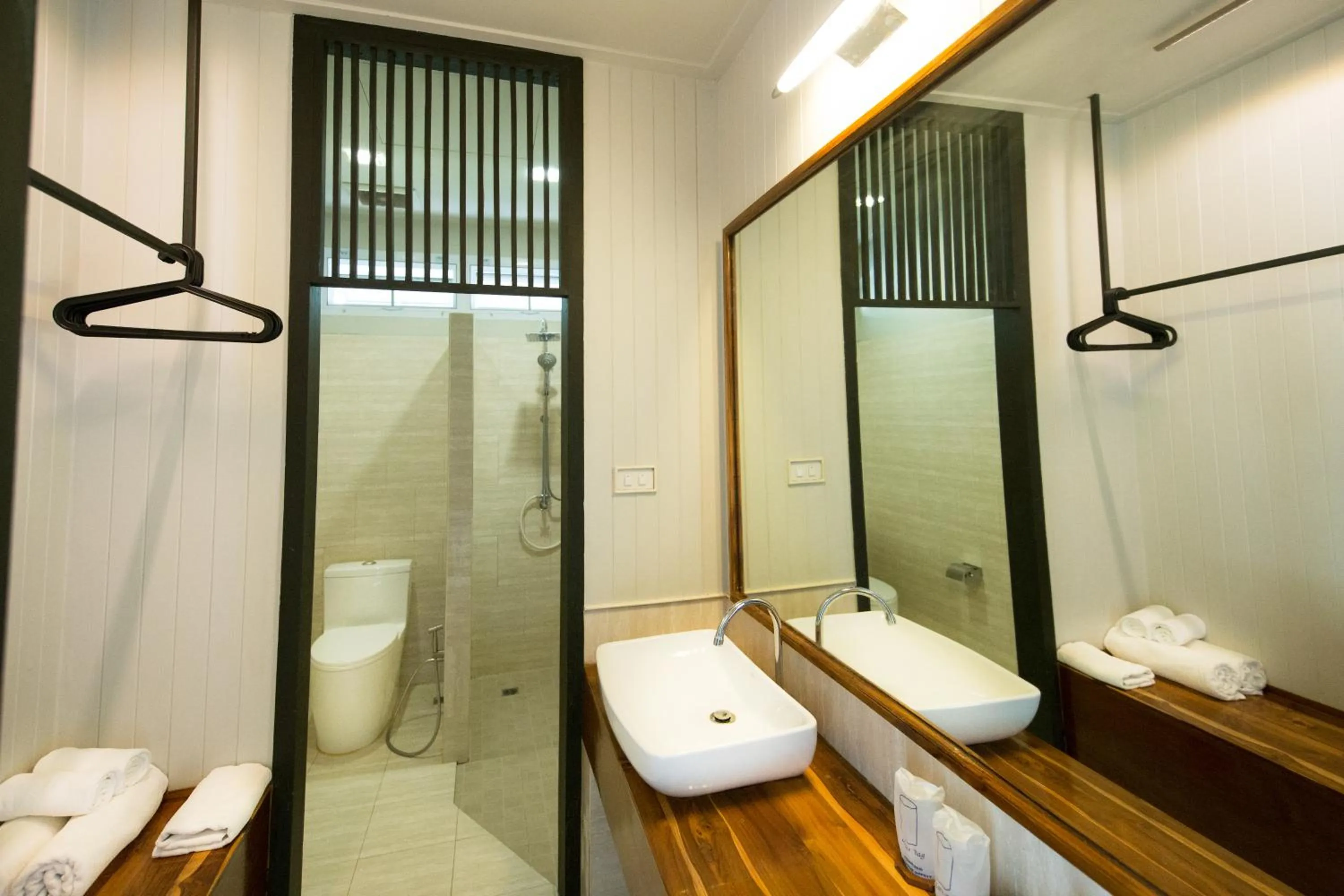 Bathroom in Dorm of Happiness by Tharaburi Resort