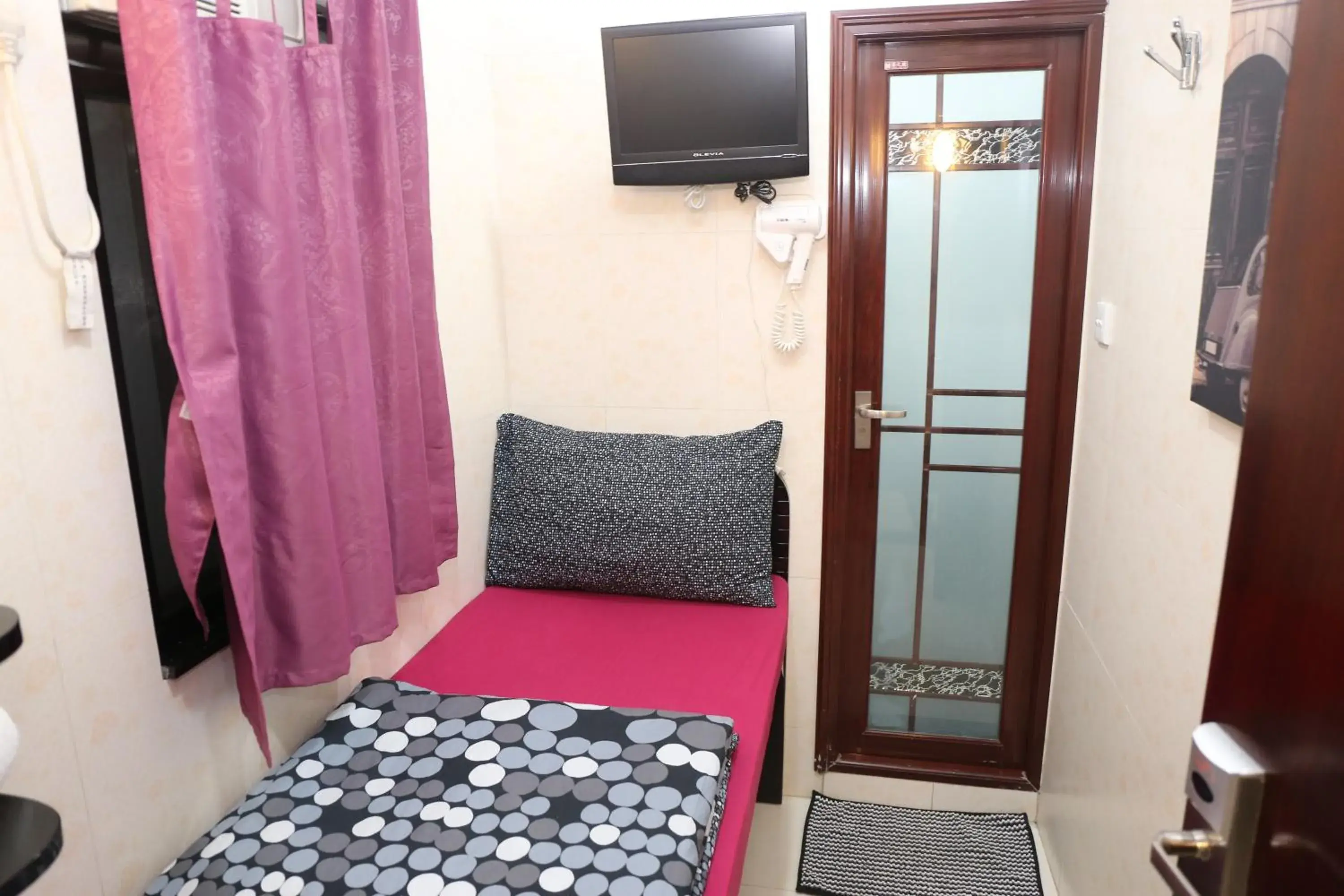 Bedroom, TV/Entertainment Center in Icon Inn Bedroom, TV/Entertainment Center in Icon Inn