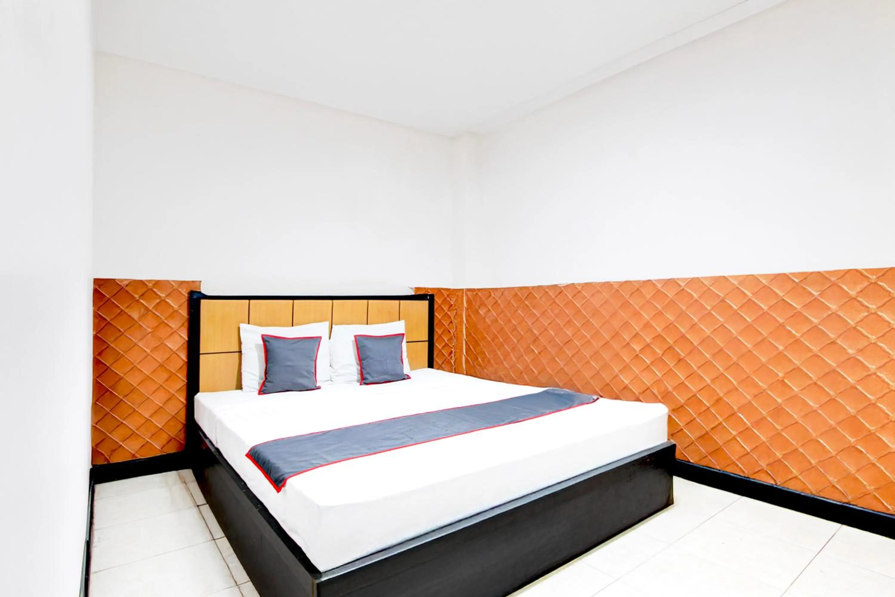 Bed in Hotel O Mega Inn Guest House