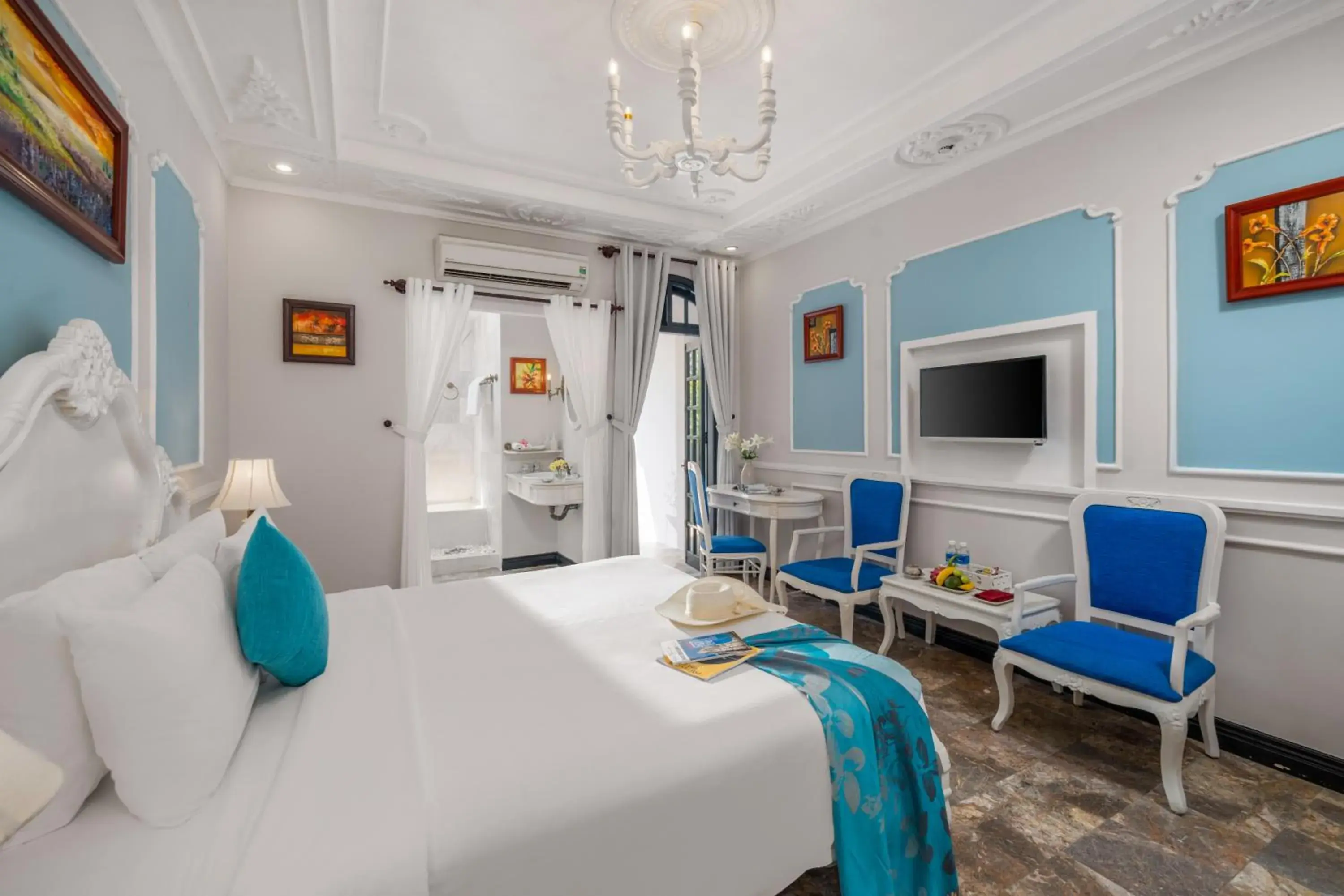 Communal lounge/ TV room, Bed in Hoi An Garden Palace and Spa - A Boutique Inspired by Nature Communal lounge/ TV room, Bed in Hoi An Garden Palace and Spa - A Boutique Inspired by Nature