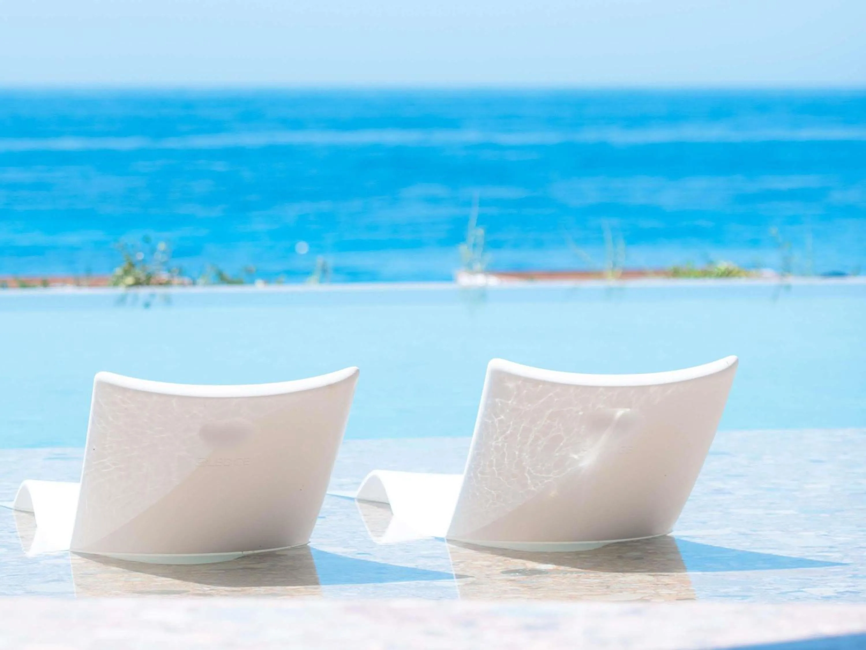 Pool view in Green Coast Hotel MGallery Collection