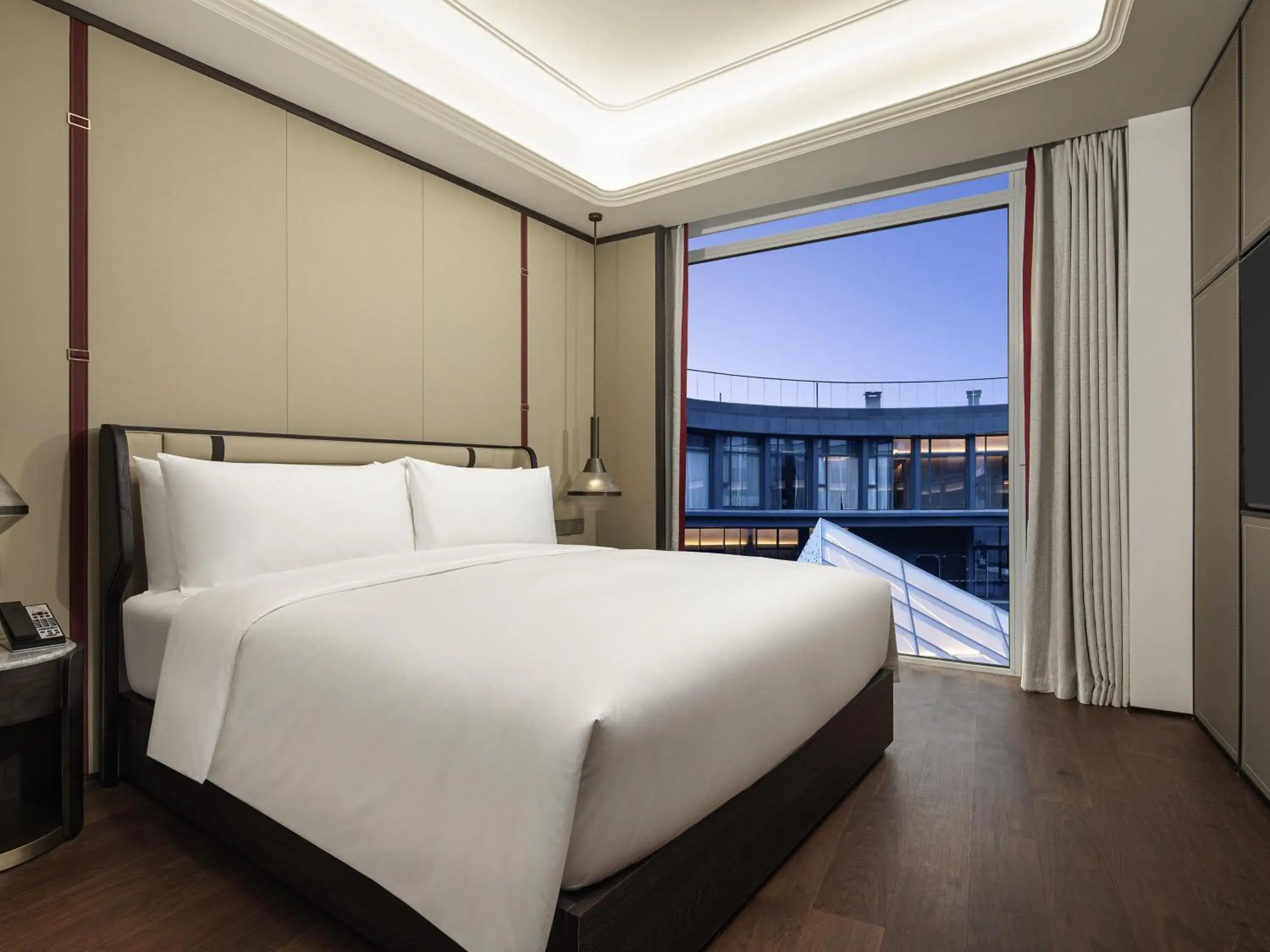 Bedroom in Movenpick by Accor Qingdao Sunmei Bedroom in Movenpick by Accor Qingdao Sunmei