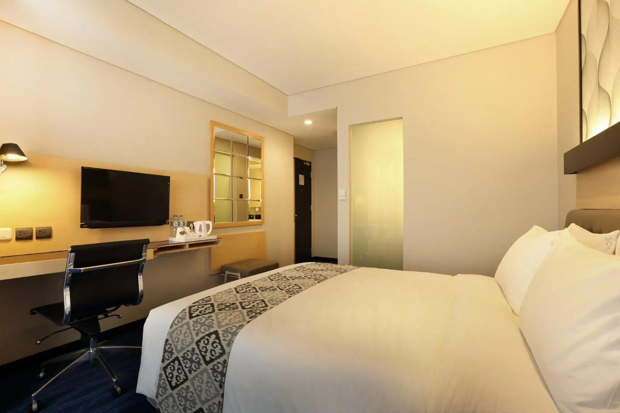 Photo of the whole room, Bed in AI Hotel Jakarta Thamrin