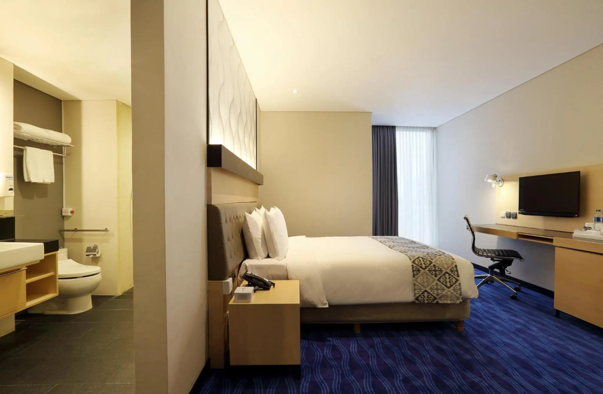 Photo of the whole room, Bed in AI Hotel Jakarta Thamrin