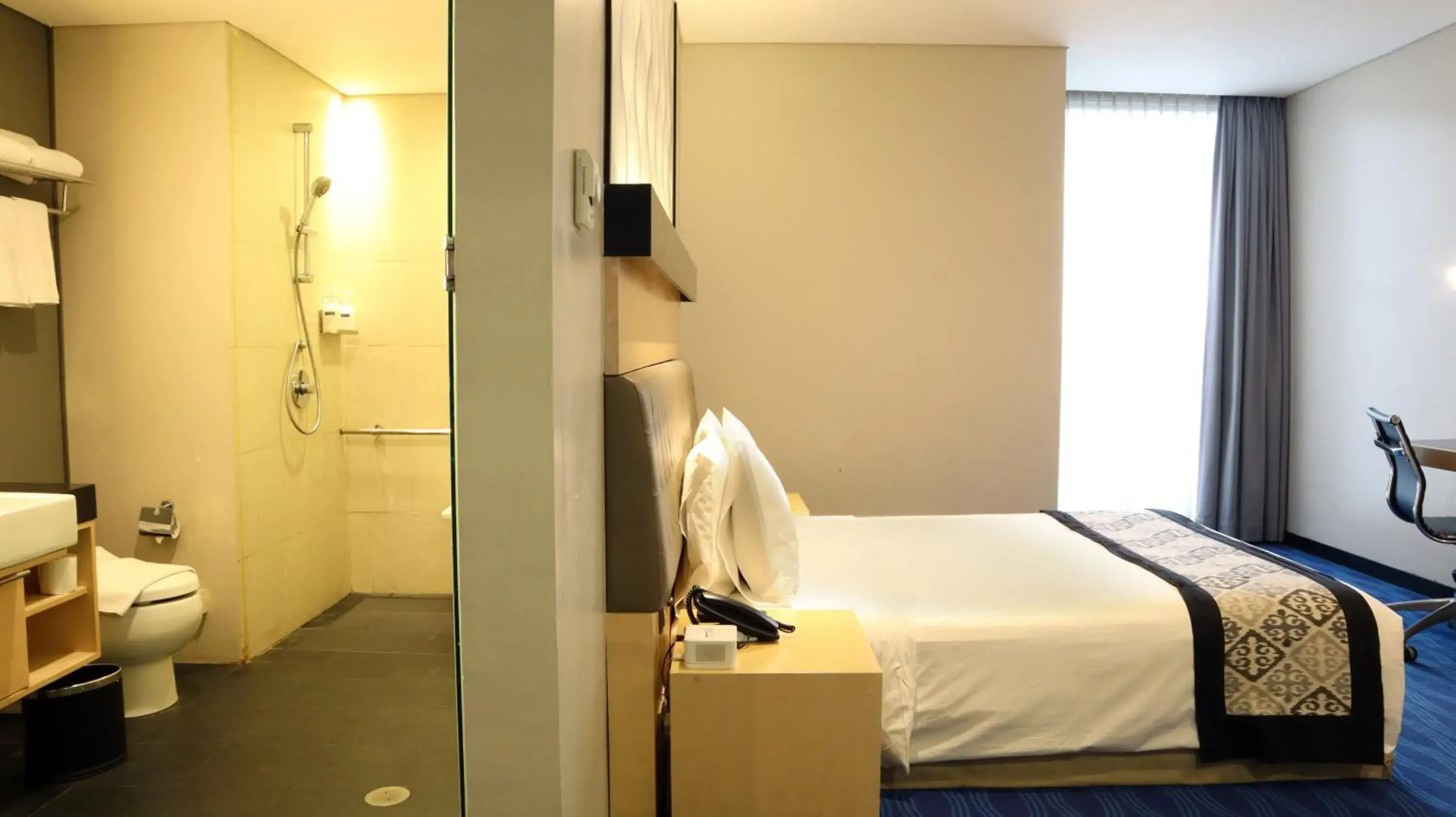 Bed, Bathroom in AI Hotel Jakarta Thamrin
