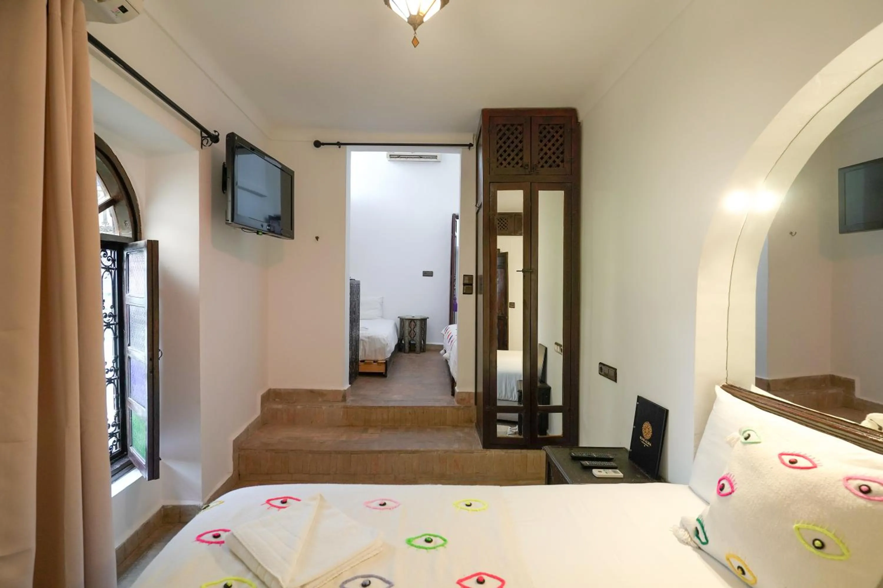 Bed in Riad Alma Mouassine