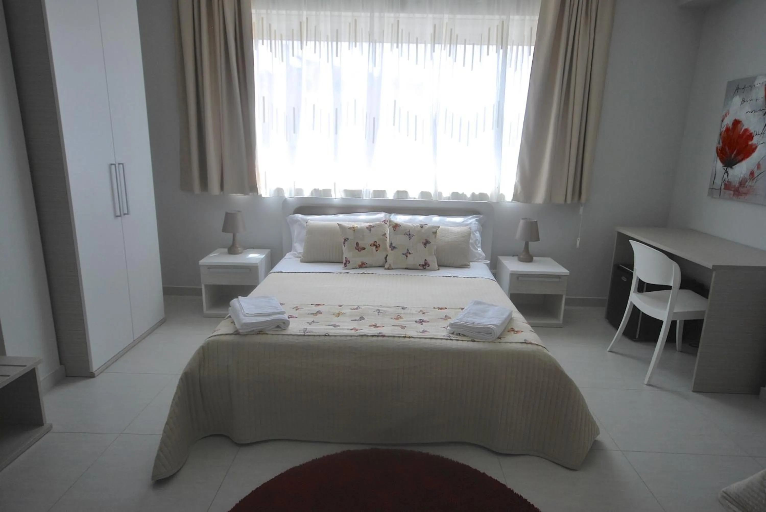 Bed in Pietra Bianca Rooms