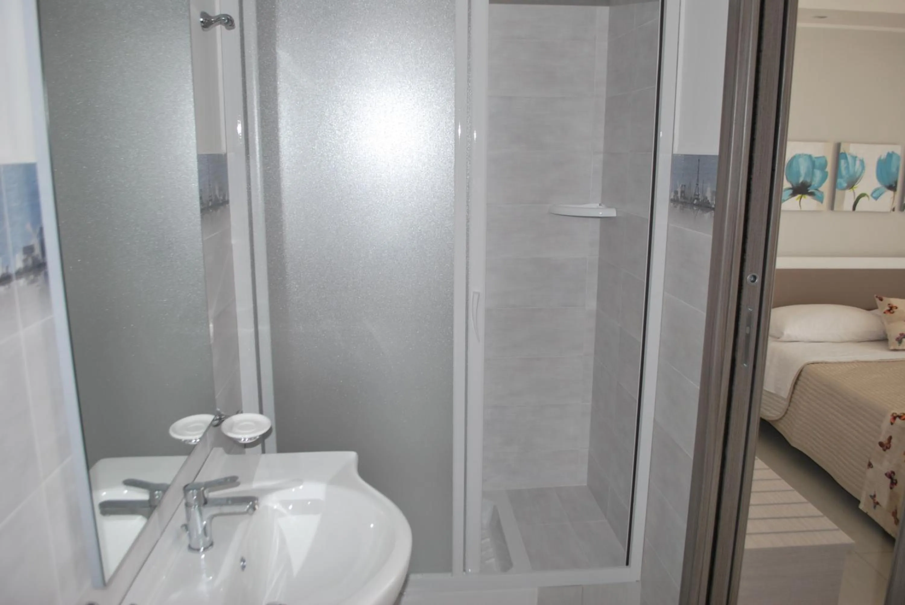 Bed in Pietra Bianca Rooms