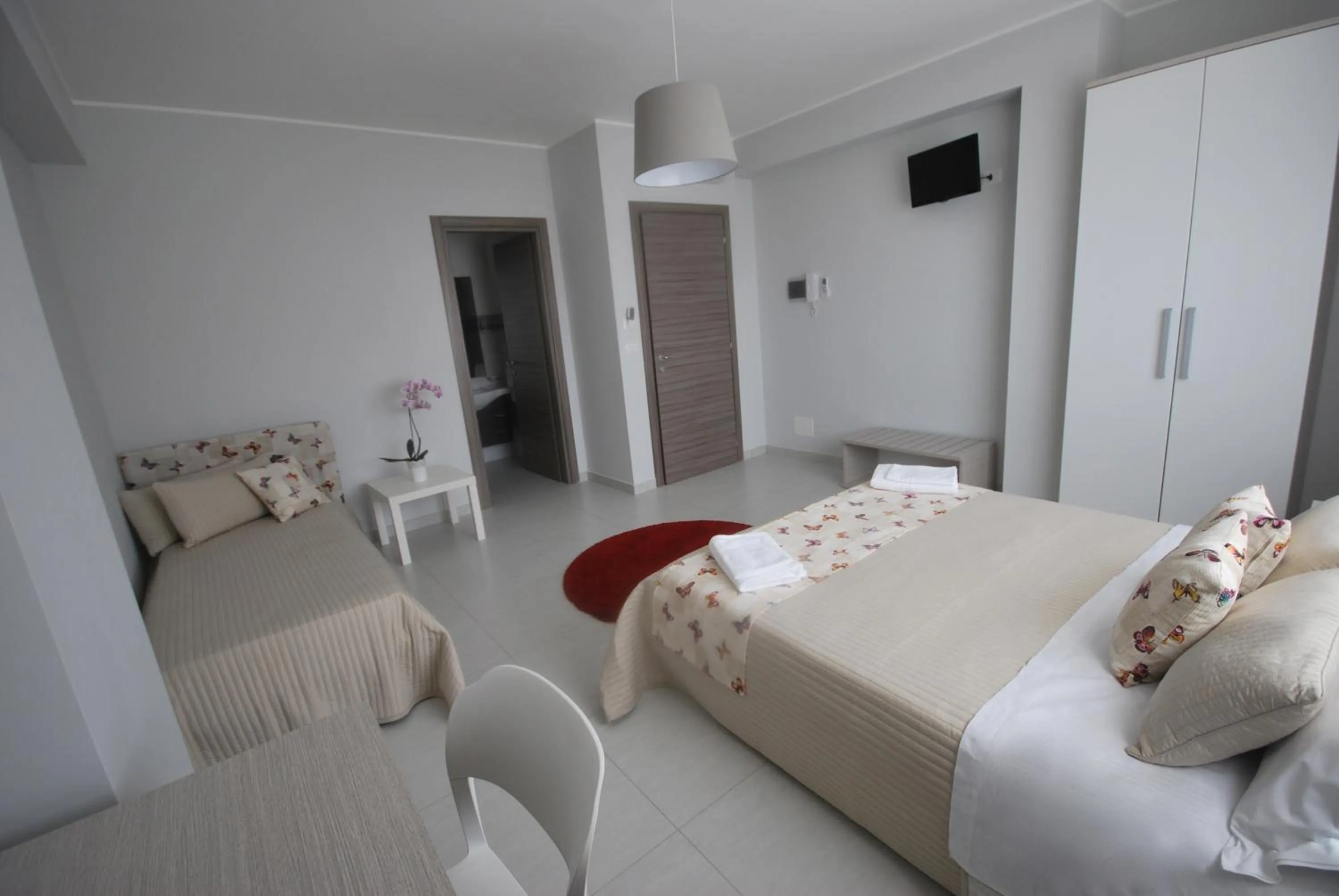 Bed in Pietra Bianca Rooms