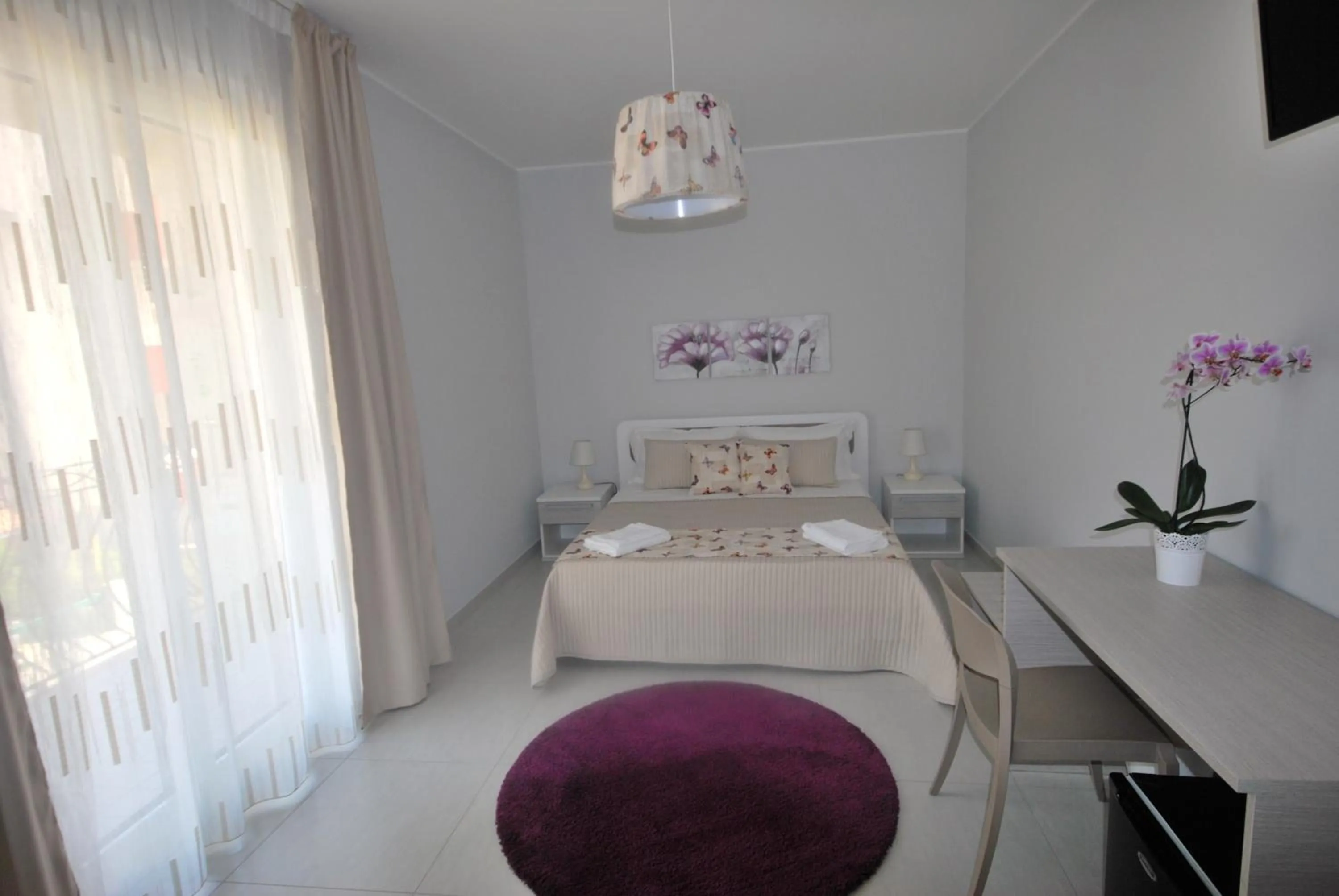 Bed in Pietra Bianca Rooms