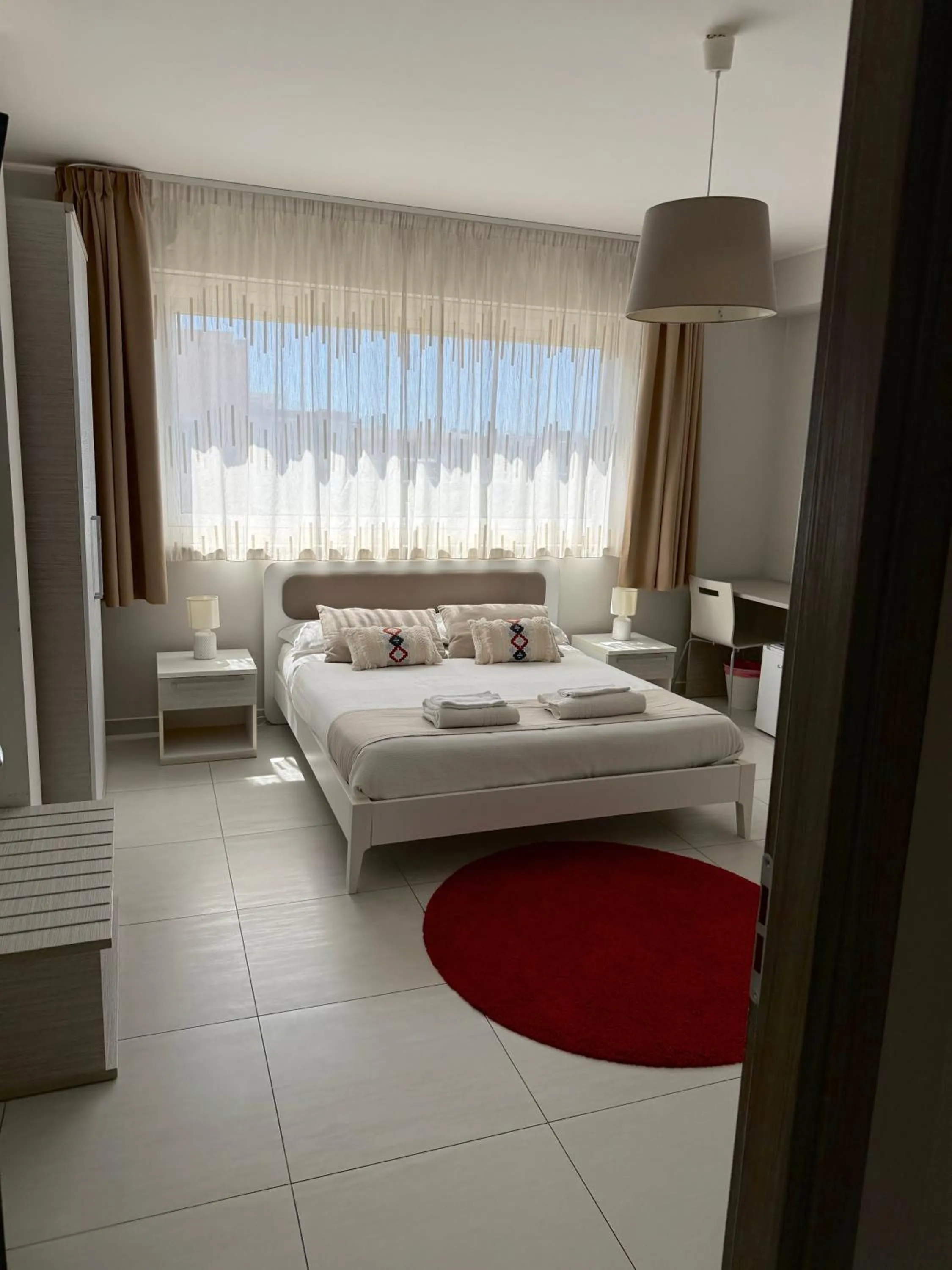 Bed in Pietra Bianca Rooms