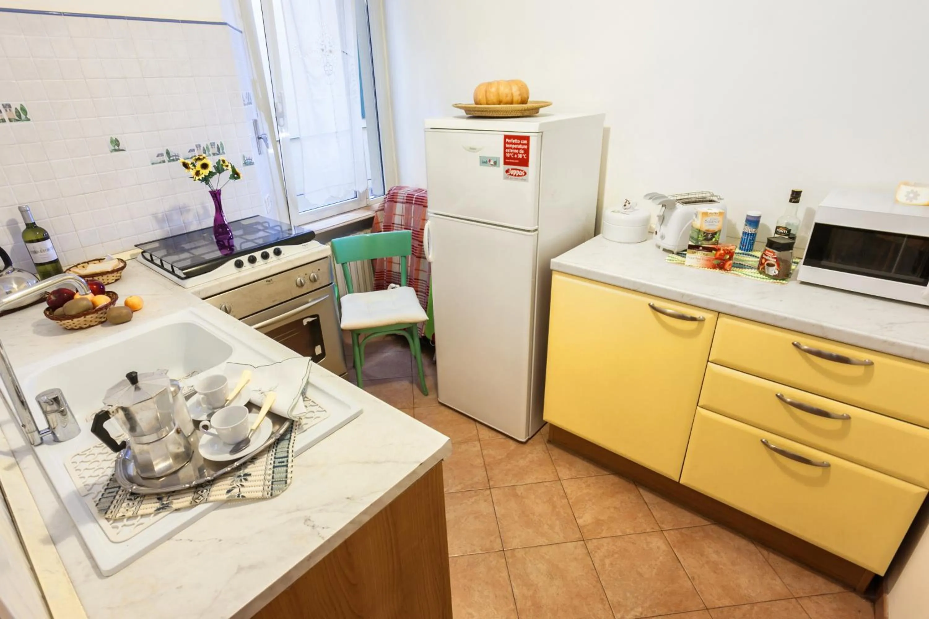 Communal kitchen in Prati Vatican Apartment