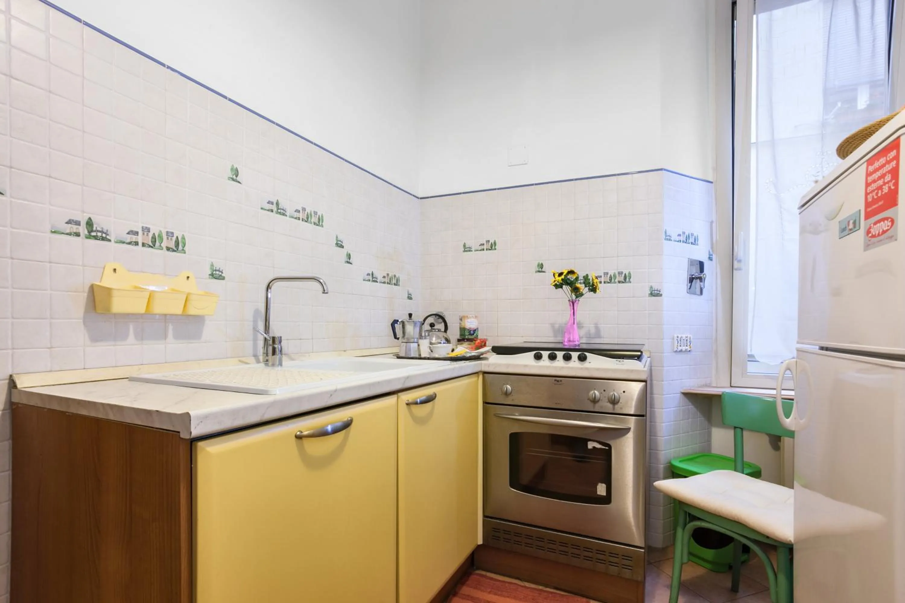Communal kitchen in Prati Vatican Apartment