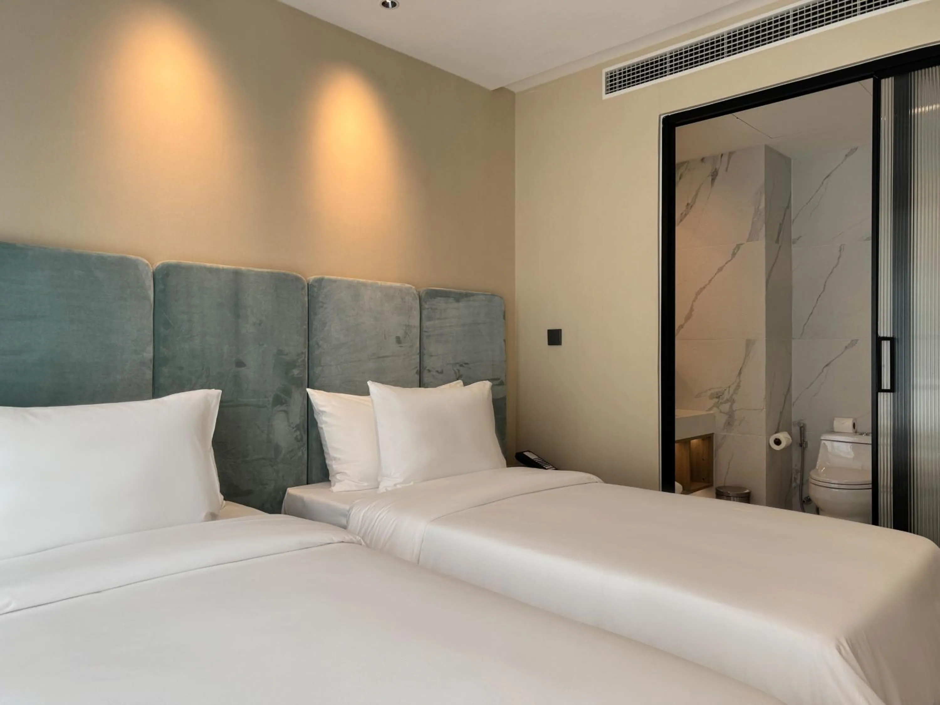 Bed in Laya Suites and Residences