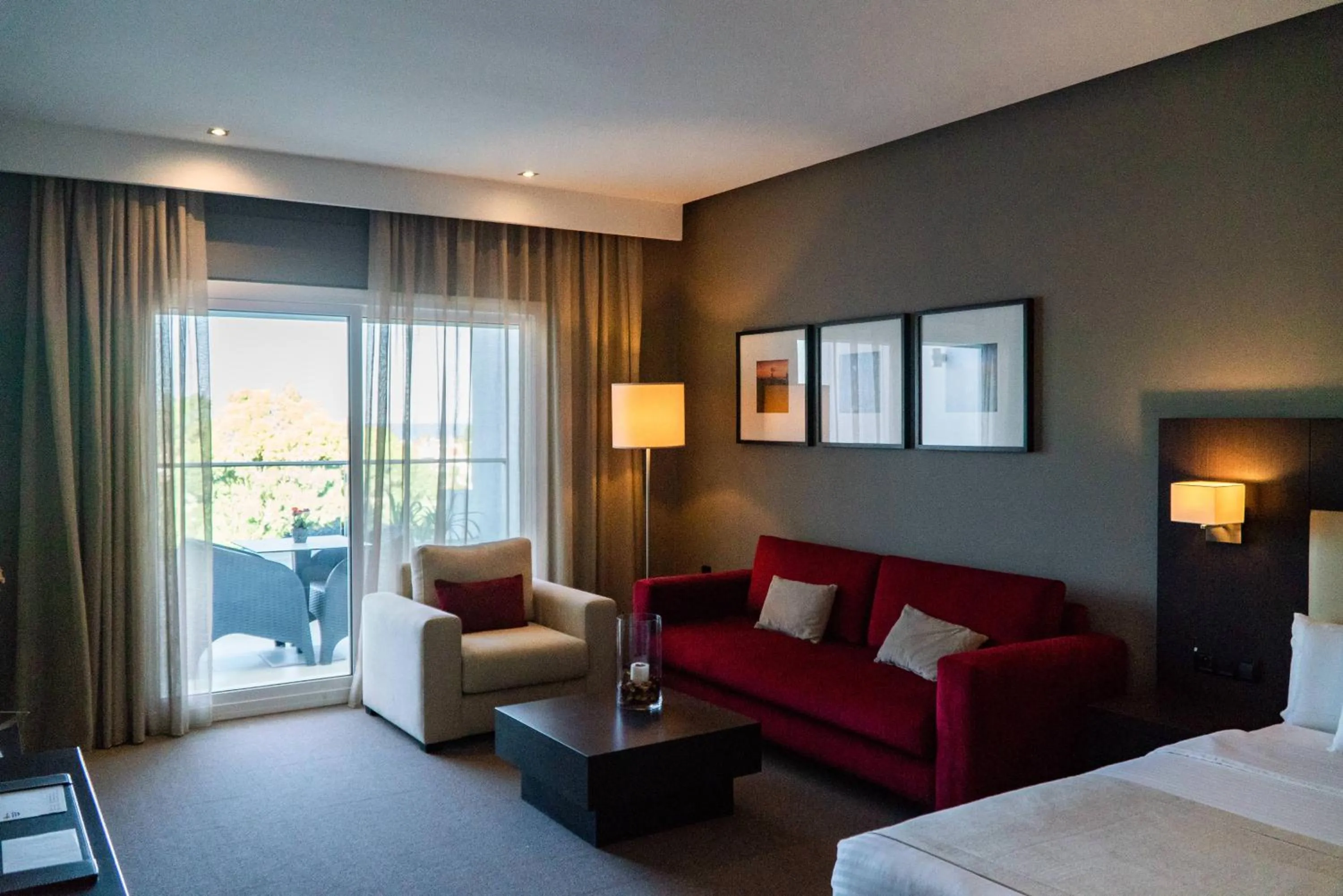 Seating area, Bed in Hôtel Tamuda Beach