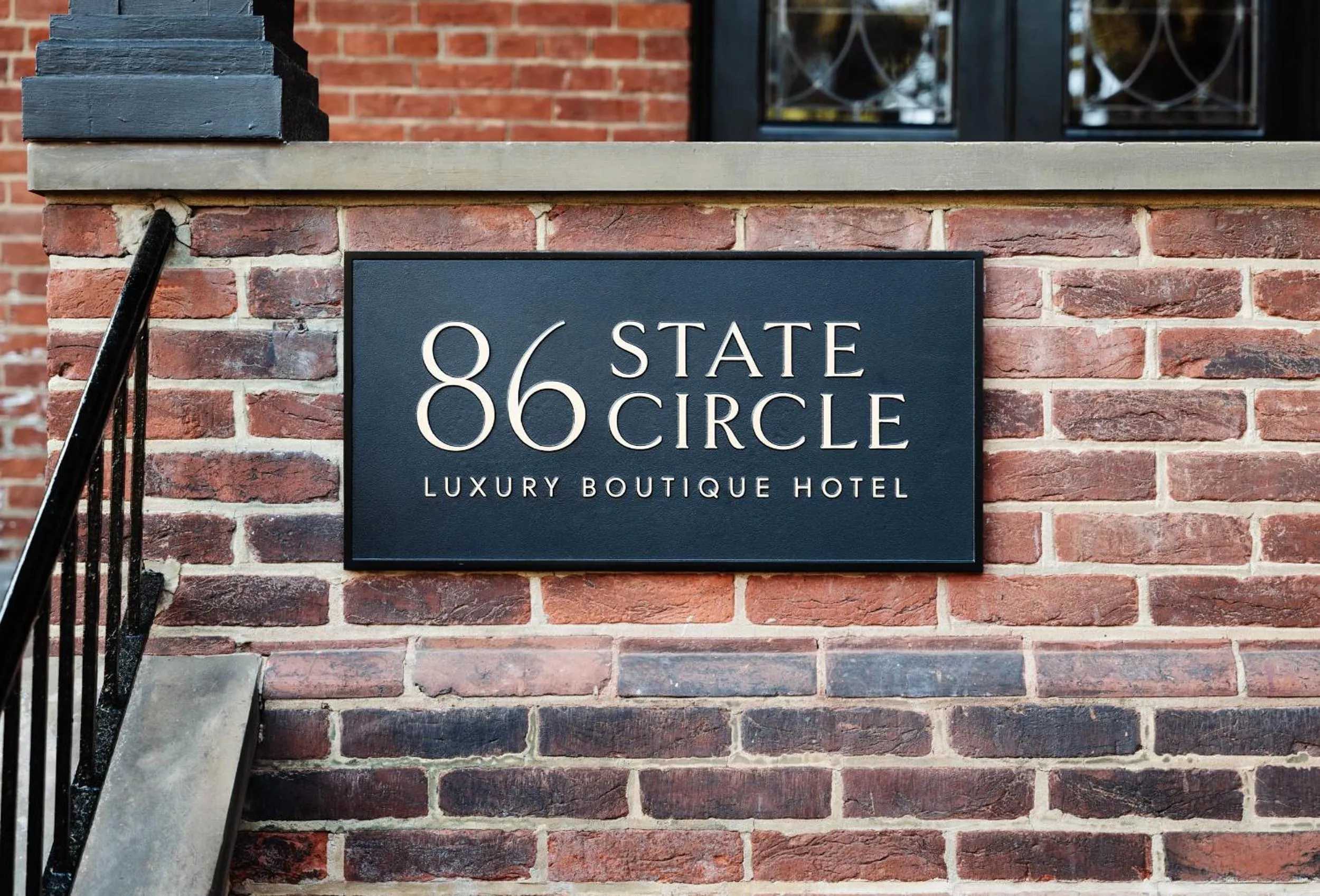 Property logo or sign in 86 State Circle - Luxury Boutique Hotel