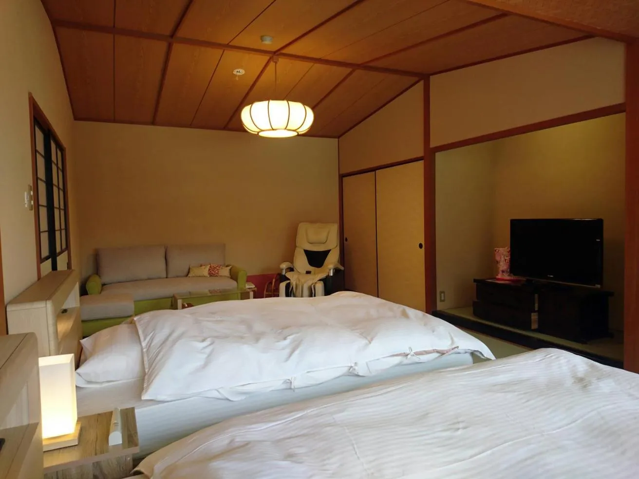 Bed in Hotel Kunitomi Suisennkaku