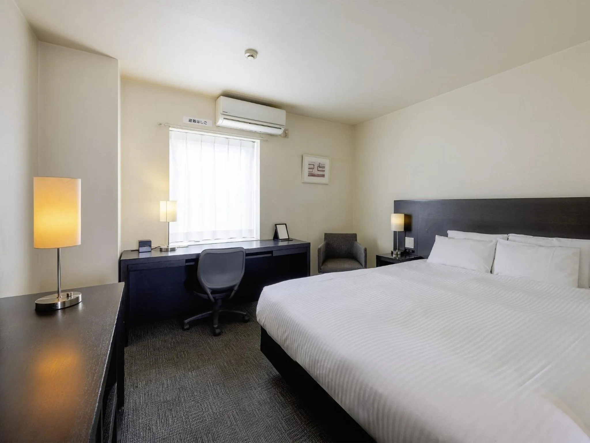 Bed in KOKO HOTEL Yokohama Tsurumi