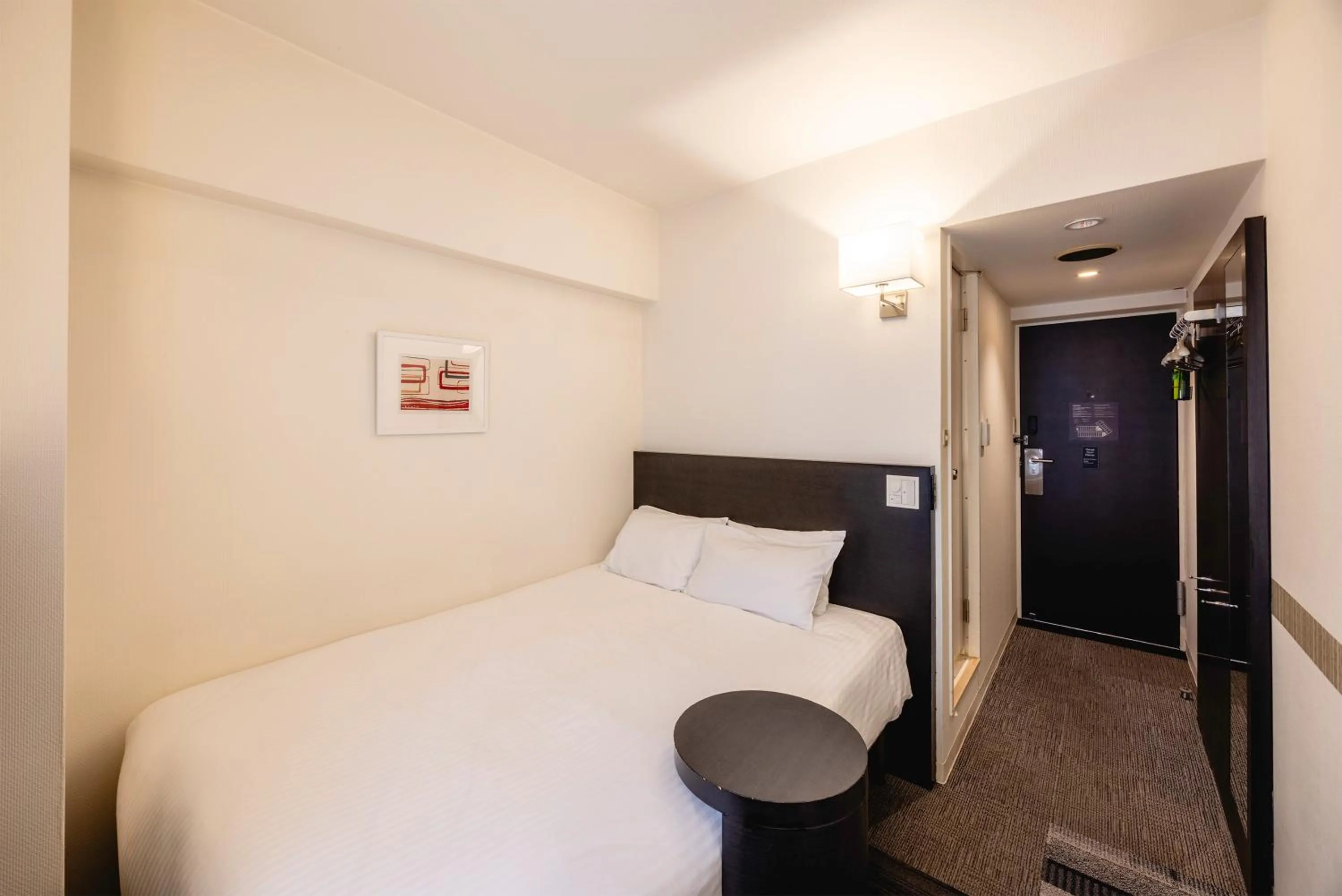 Bed in KOKO HOTEL Yokohama Tsurumi