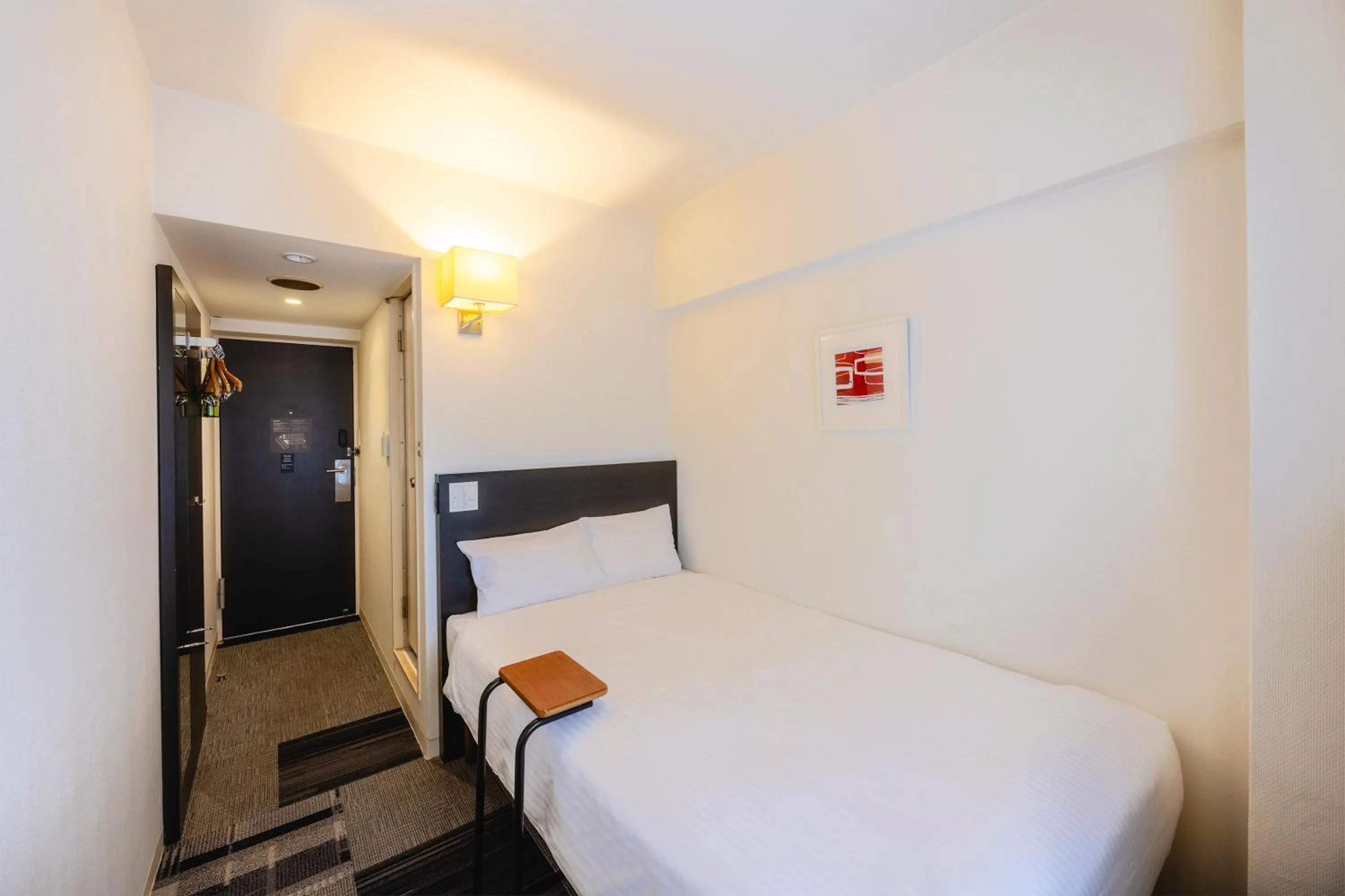 Bed in KOKO HOTEL Yokohama Tsurumi