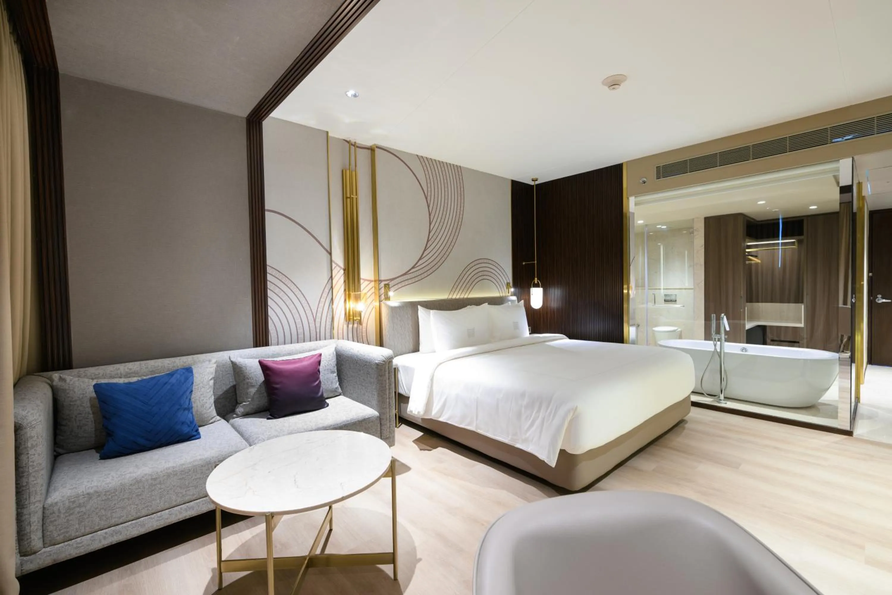 Seating area, Bed in Merlis Hotel Coimbatore