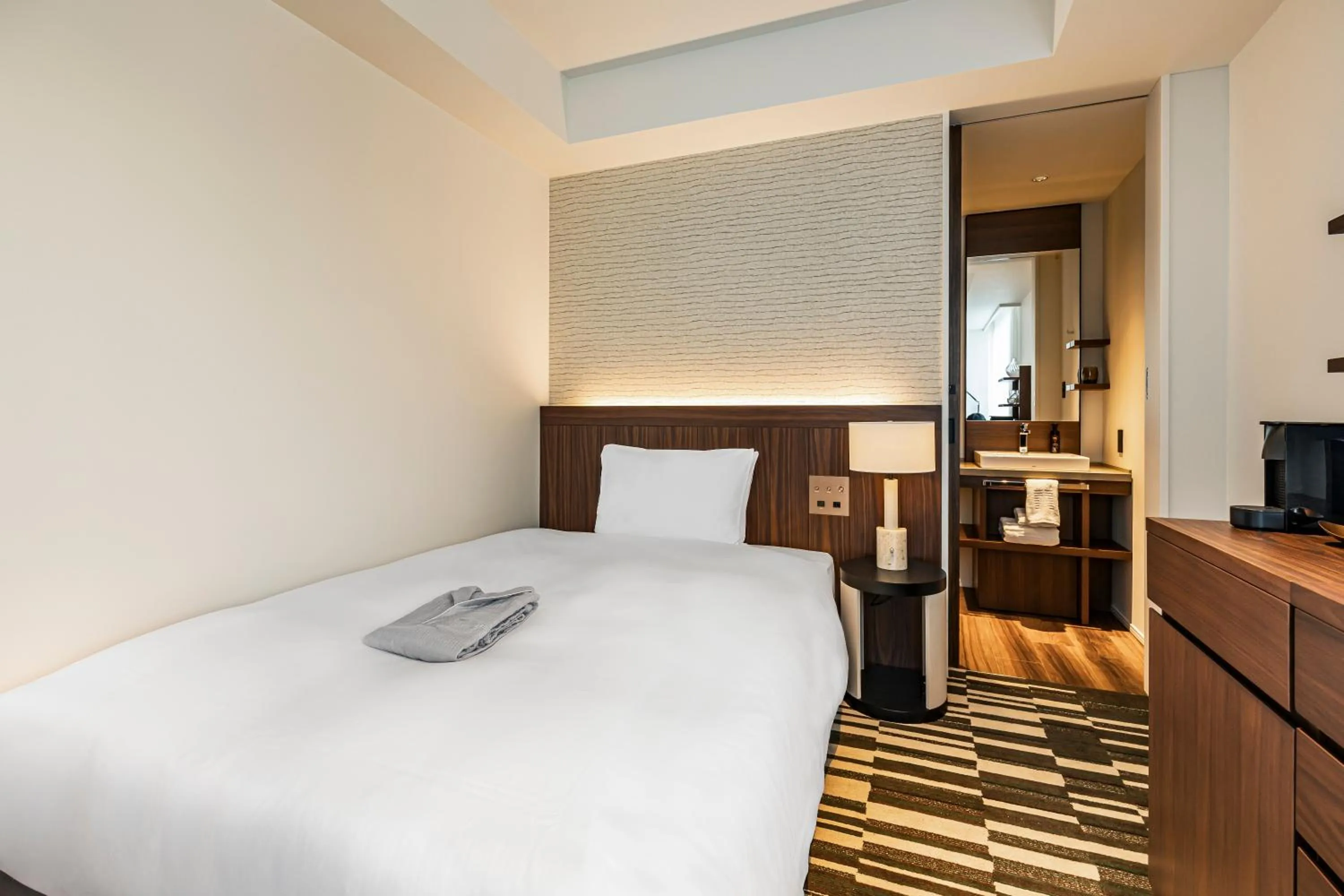 Bed in The Gate Hotel Sapporo by Hulic