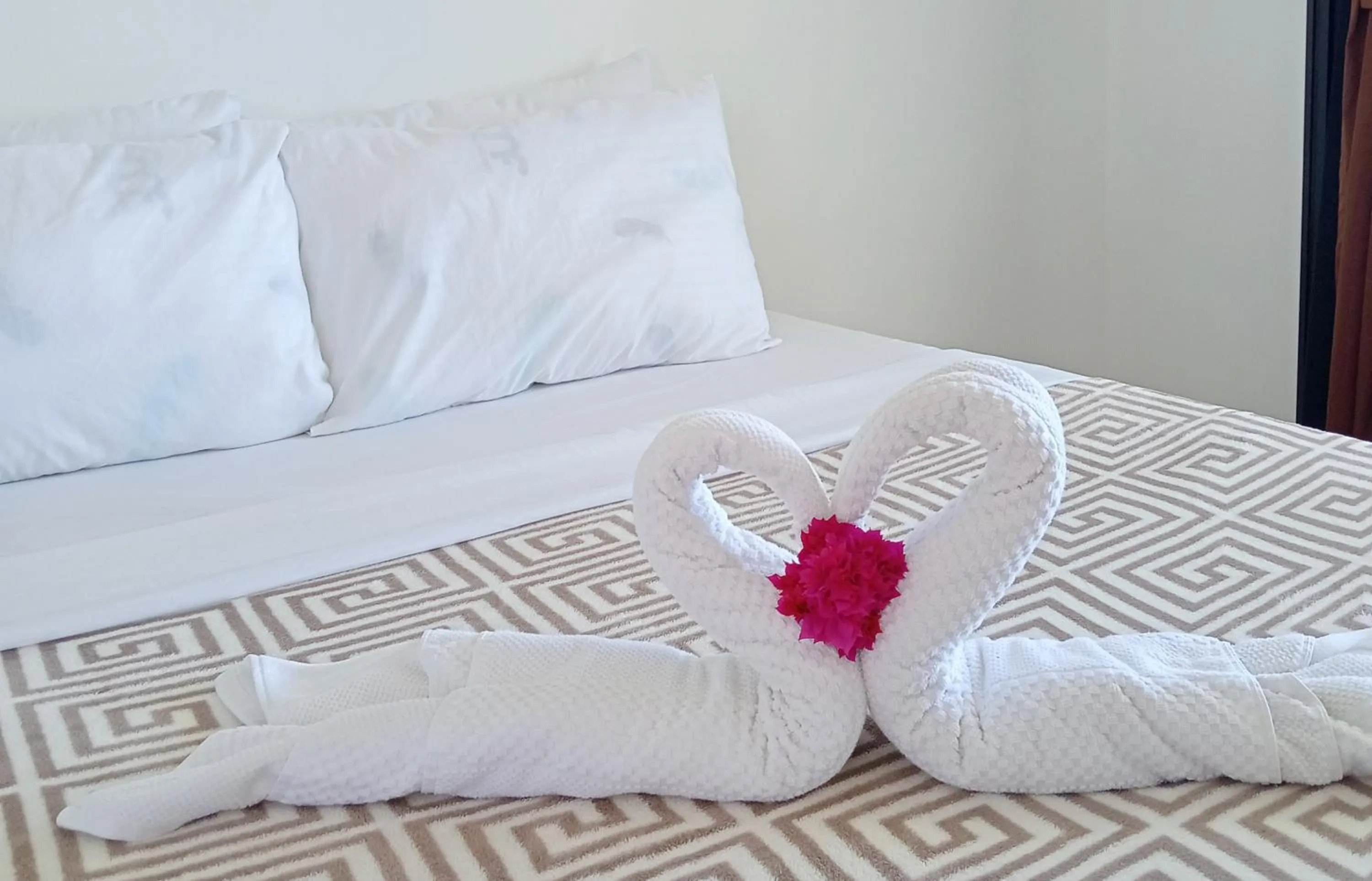 Bed in Nalusuan Island Resort and Marine Sanctuary