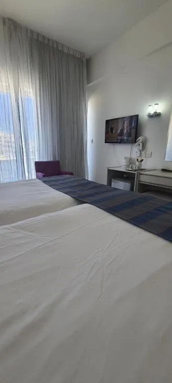 Bed in Silver Sands Beach Hotel