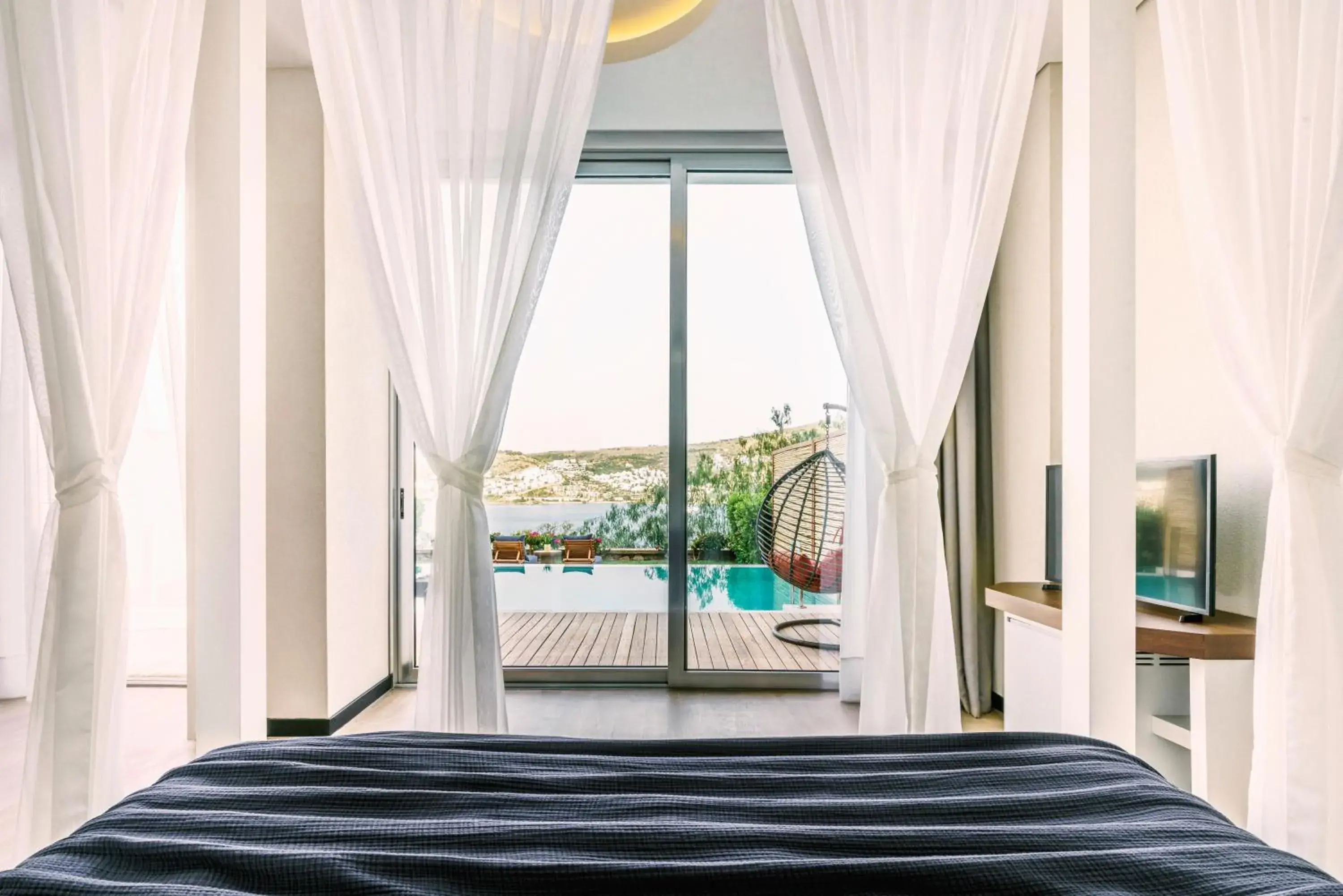 Pool view, Bed in Cape Bodrum Luxury Hotel & Beach Pool view, Bed in Cape Bodrum Luxury Hotel & Beach