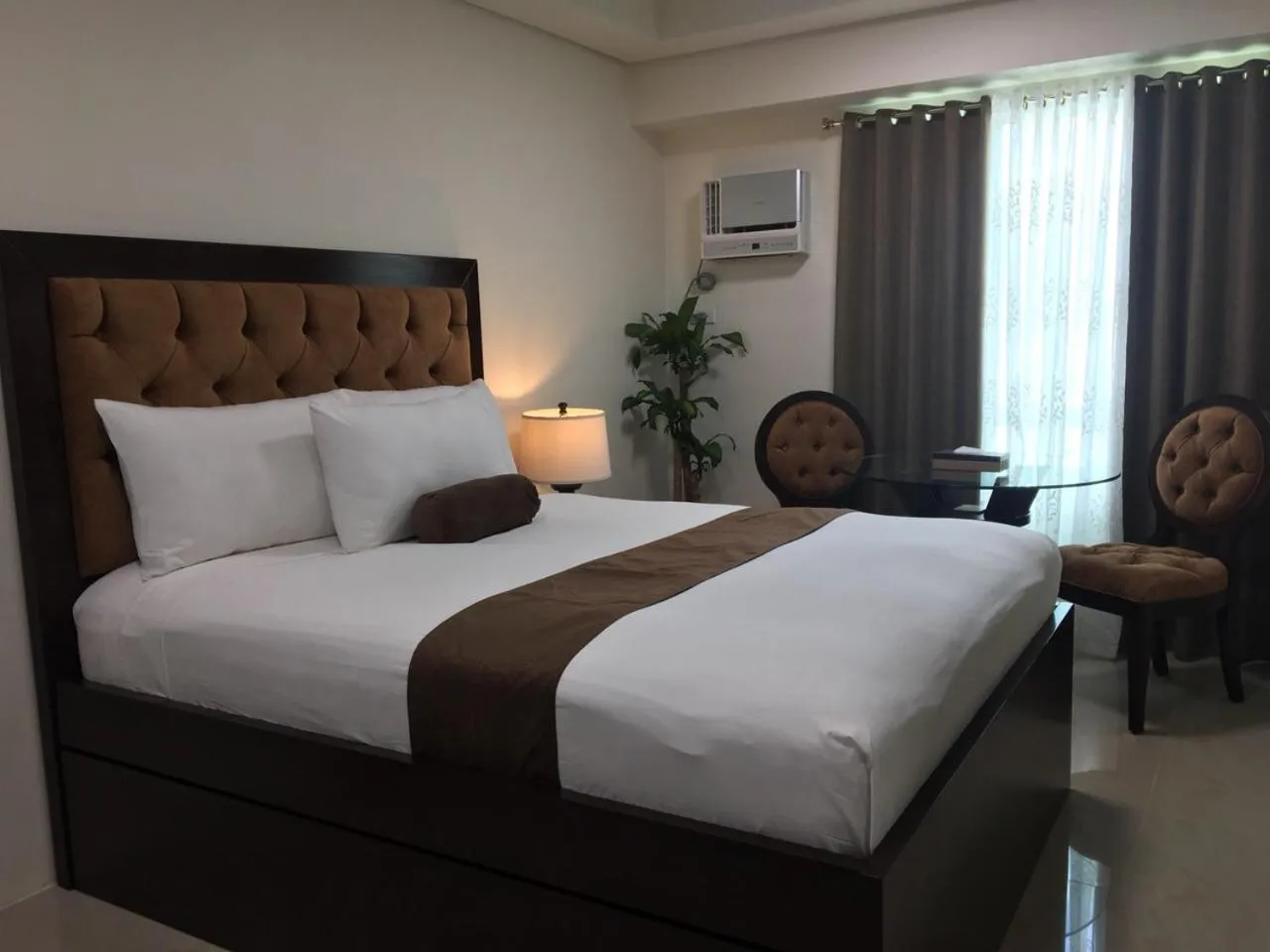 Bed in Studio Unit at The Beacon Makati