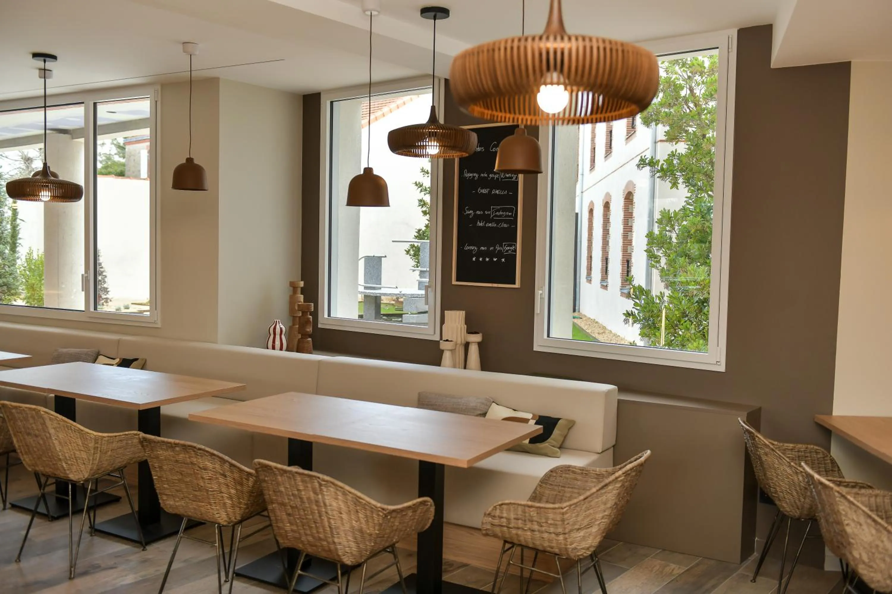 Seating area in Hotel Rivella - The Originals Boutique