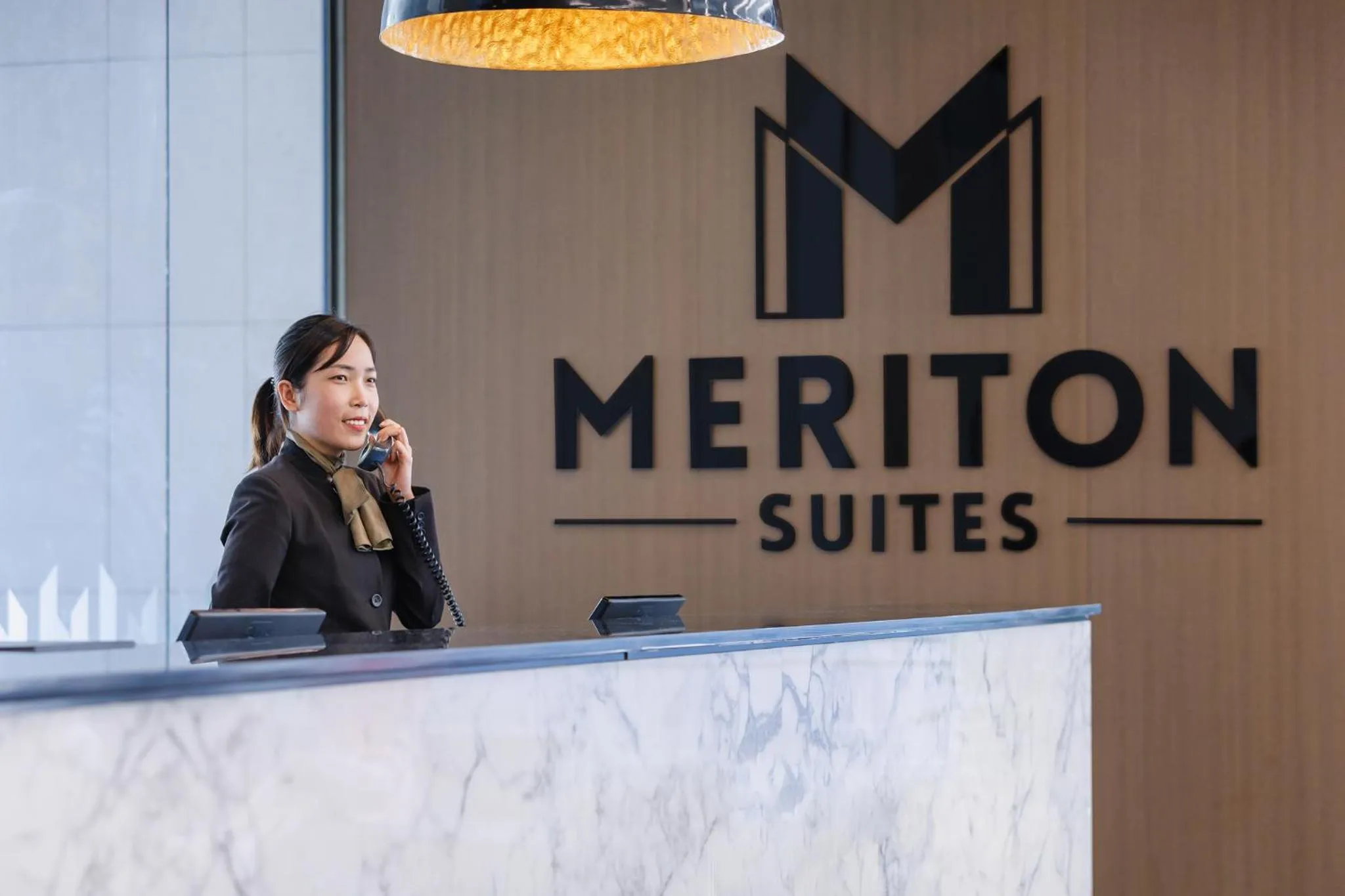 Staff in Meriton Suites Chatswood