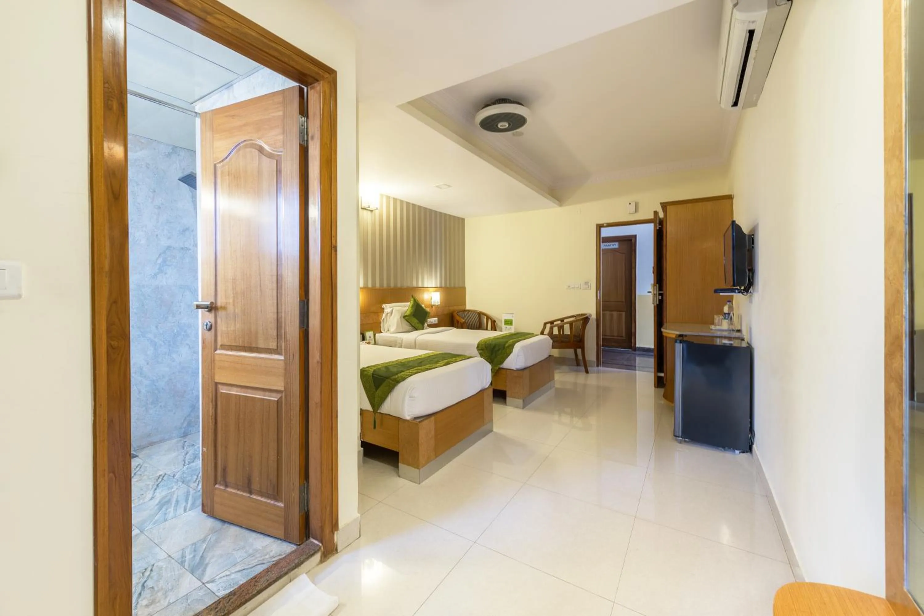 Bed in Treebo Akshaya Lalbagh Inn