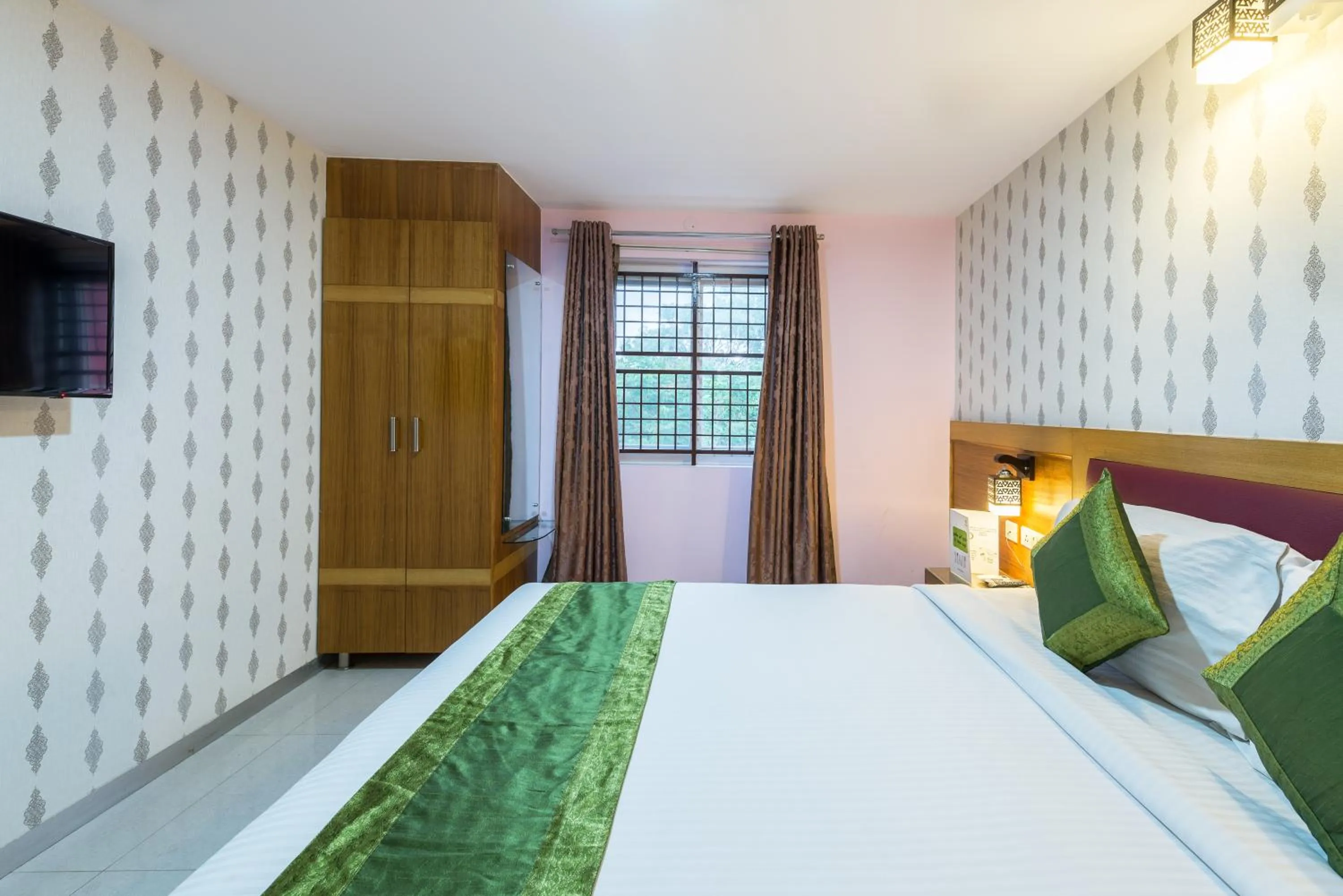 Bed in Treebo Akshaya Lalbagh Inn