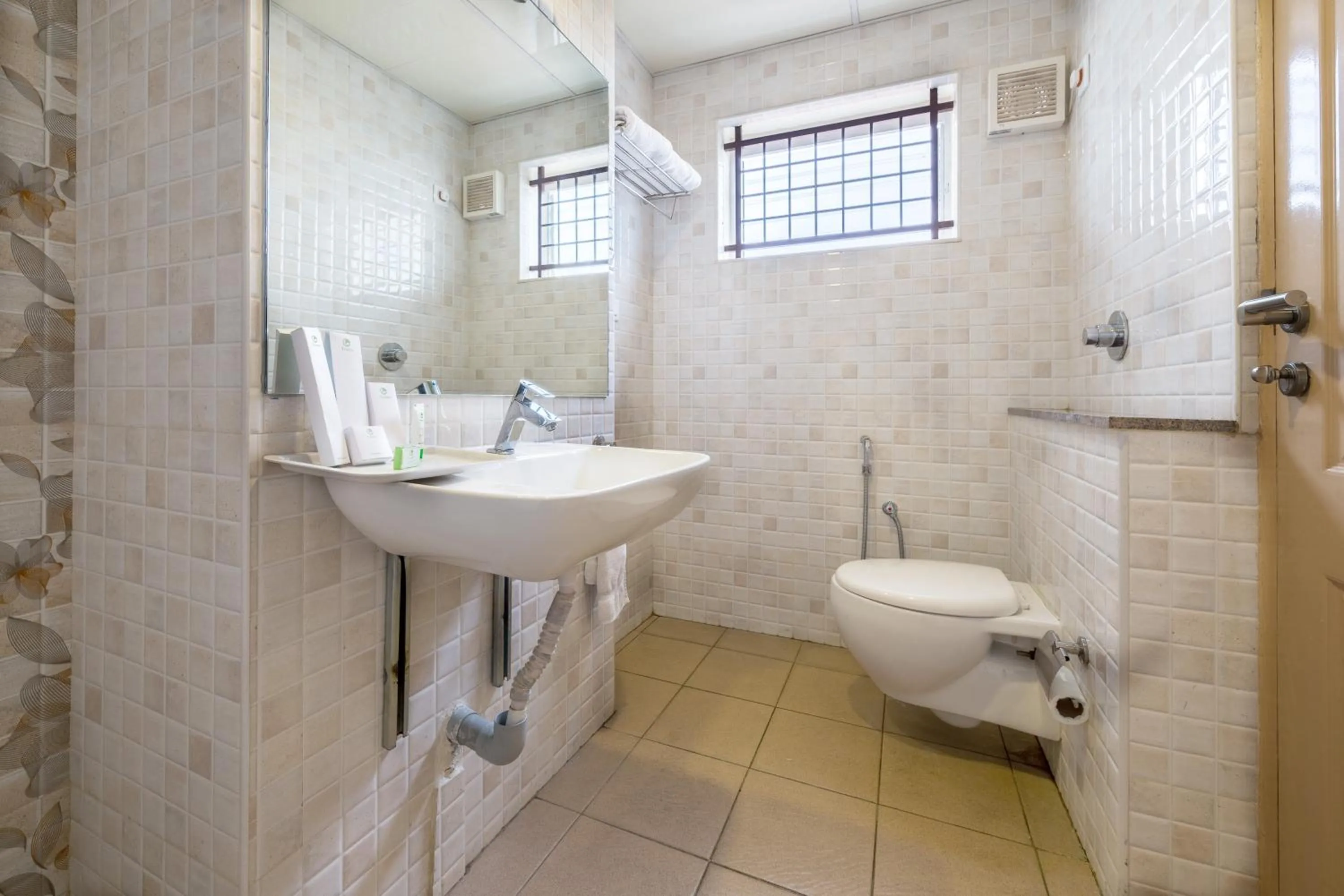 Bathroom in Treebo Akshaya Lalbagh Inn