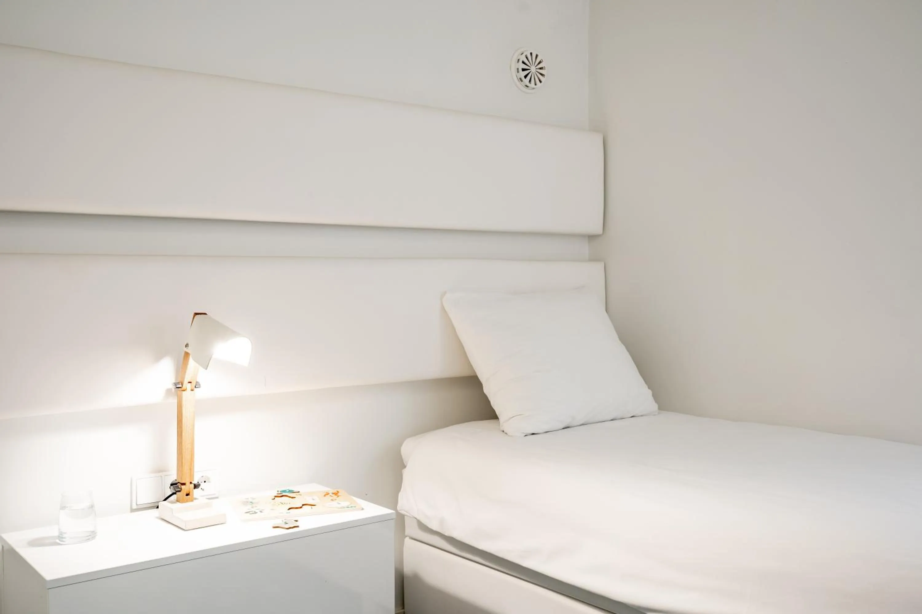 Bed in YAYS Amsterdam Salthouse Canal by Numa