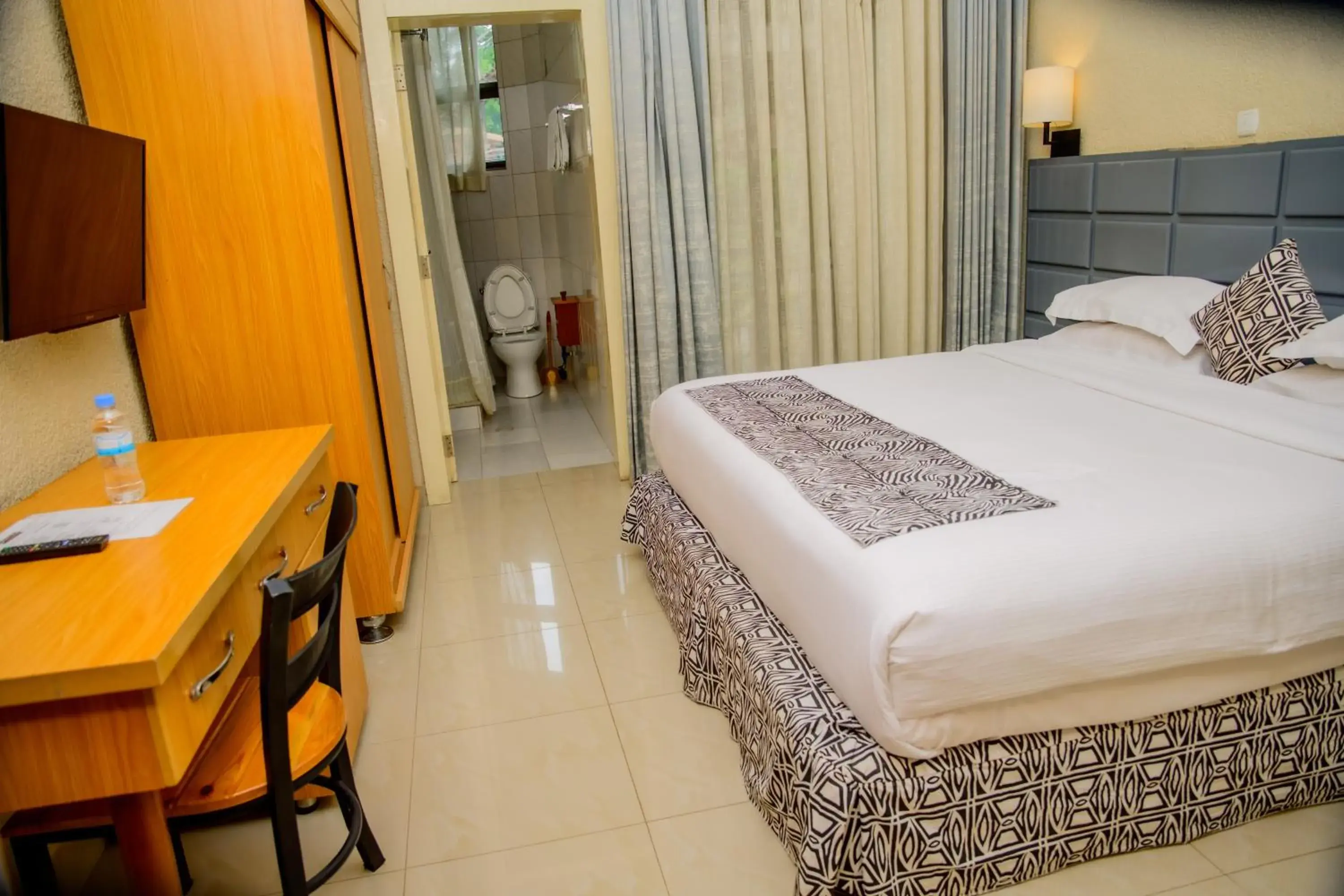 Deluxe Double Room with Balcony - single occupancy in Quality Inn Hotel Kigali Deluxe Double Room with Balcony - single occupancy in Quality Inn Hotel Kigali