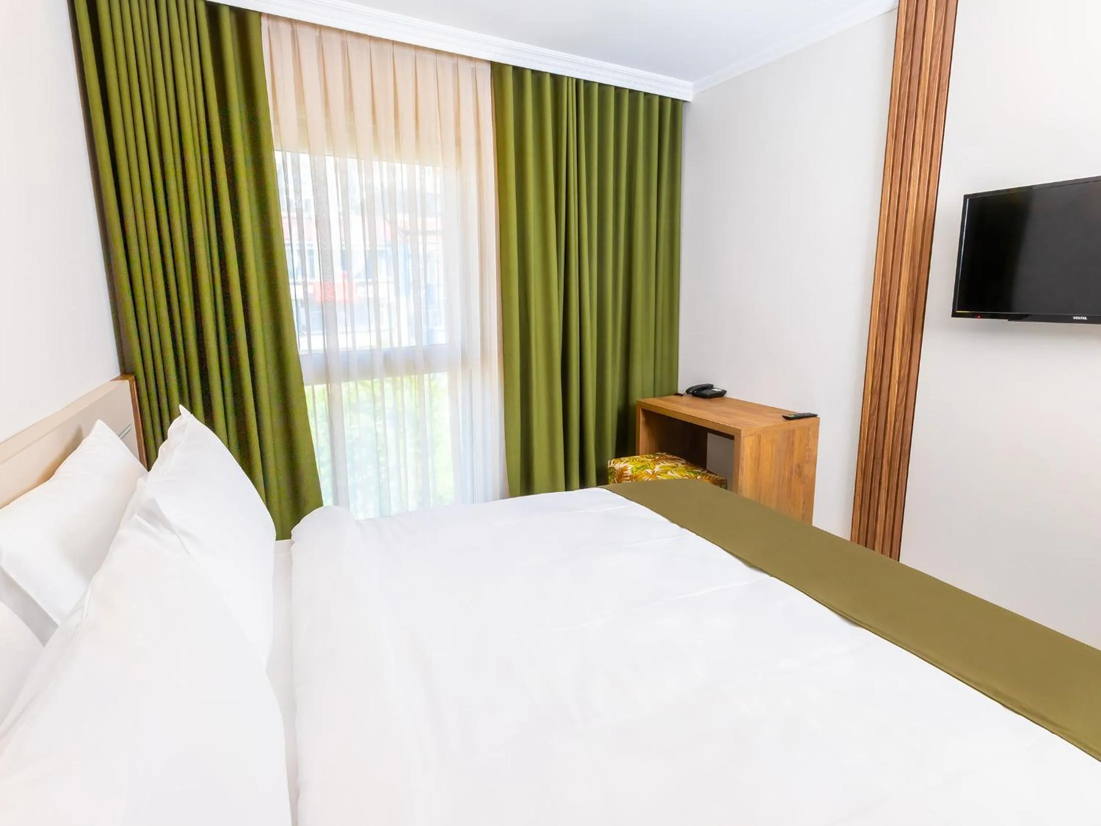 Bed in Quinnova Hotel