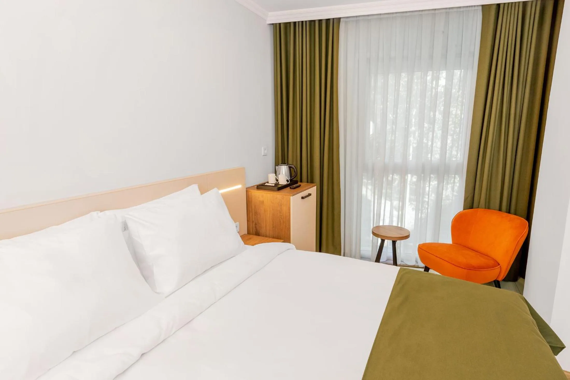 Bed in Quinnova Hotel