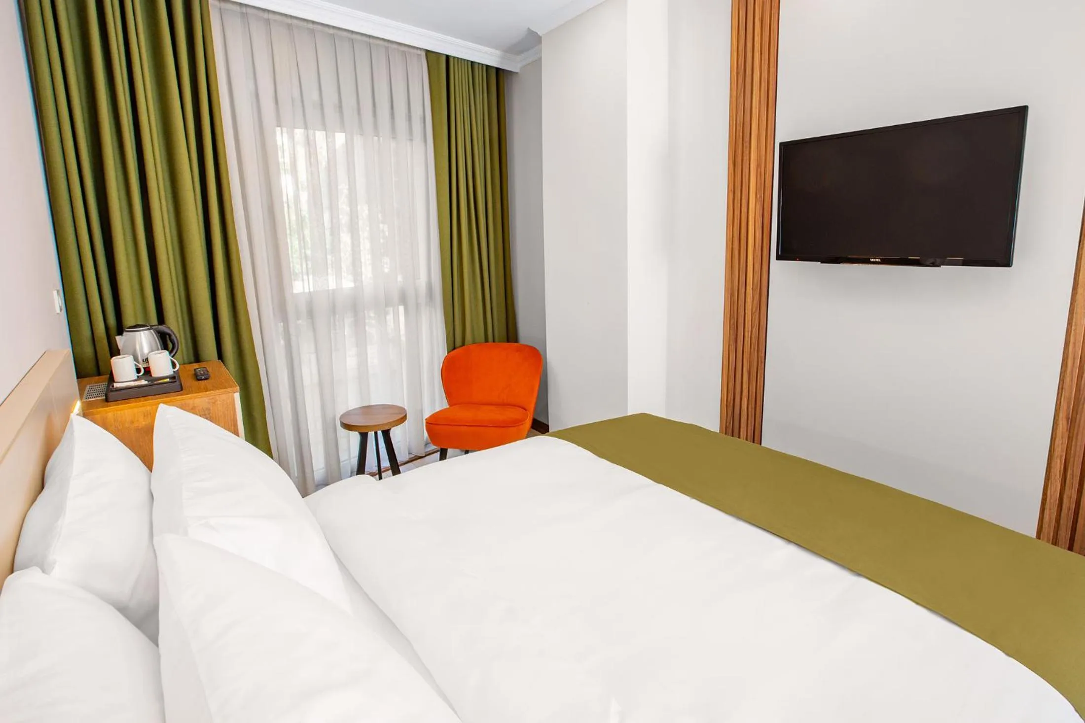 Bed in Quinnova Hotel