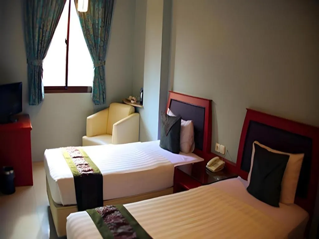 Bed in Rama Garden Hotel