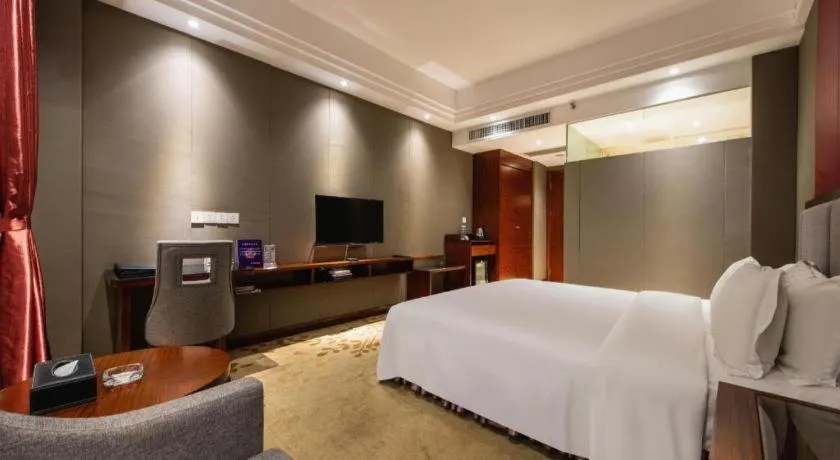 Bed in Shunde Emperor Hotel