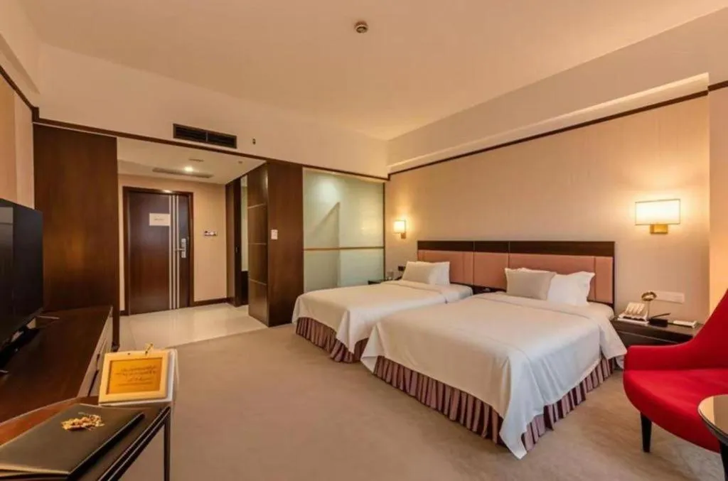 Bed in Shunde Emperor Hotel