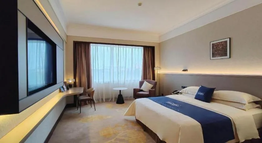 Bed in Fangzhong Holiday Hotel