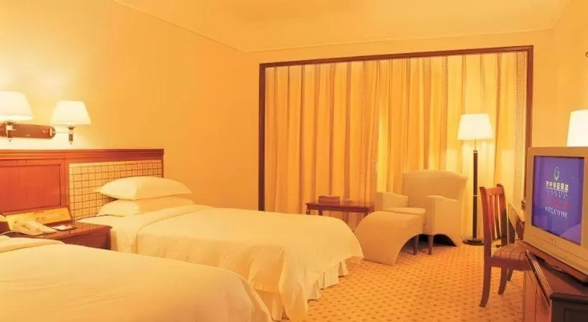 Bed in Fangzhong Holiday Hotel